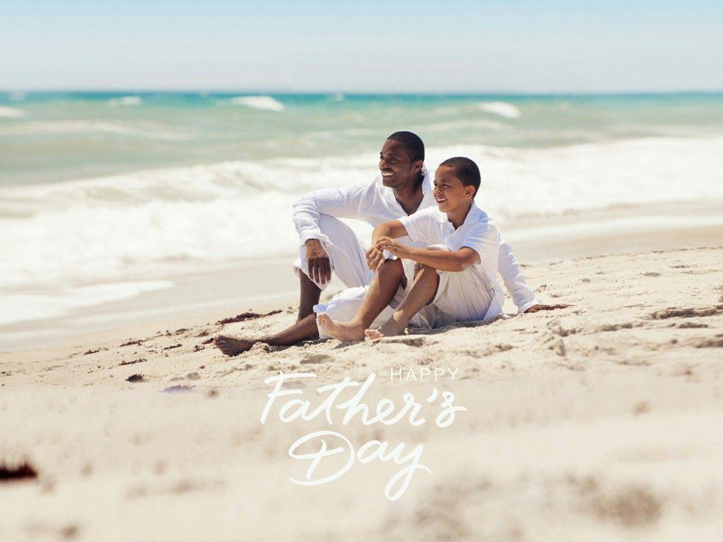 Father and Son Sitting on the Beach Happy Father's Day QHD Wallpaper