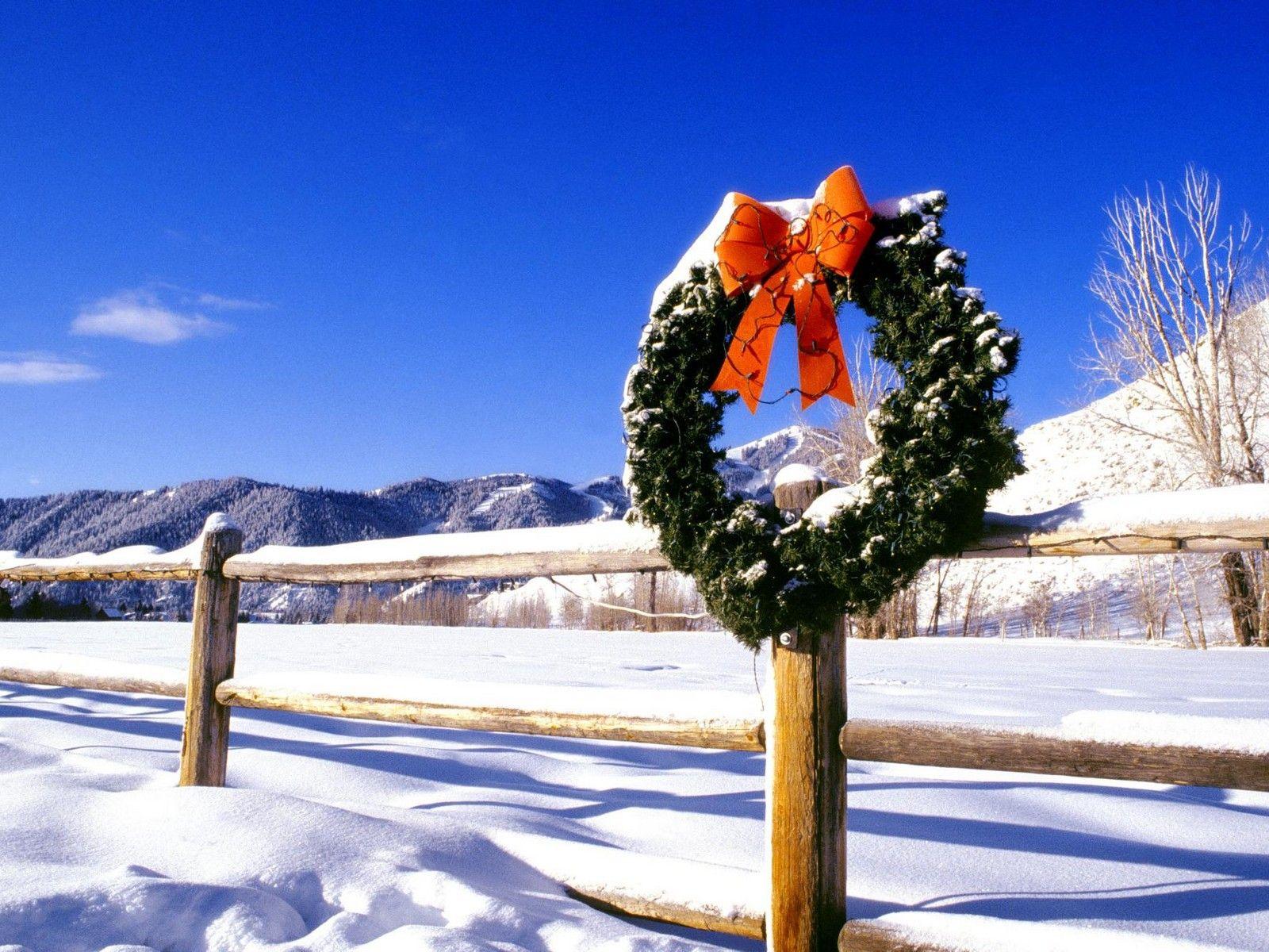 Wreath on a fence on Christmas wallpaper and image