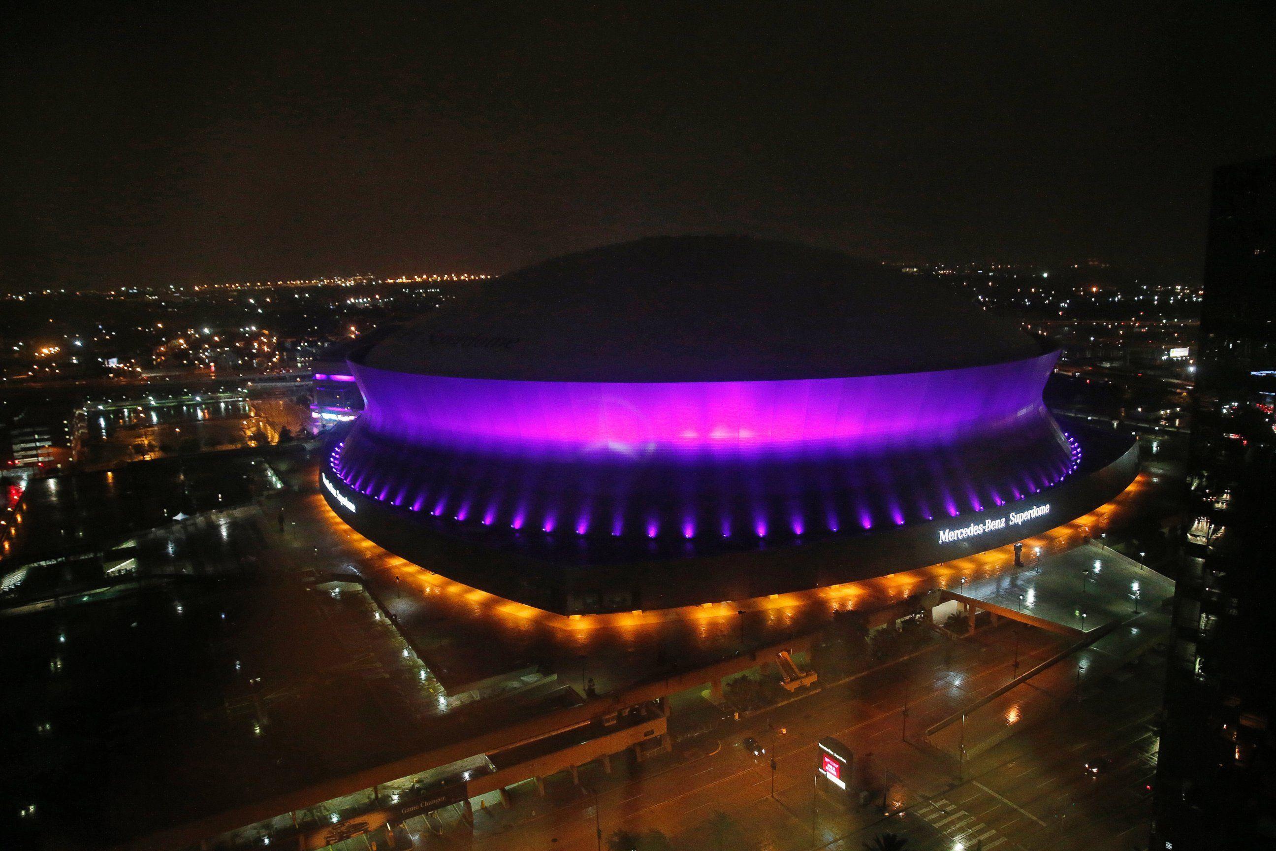 The Mercedes Benz Superdome Is Lit Up In The Color Purple In New