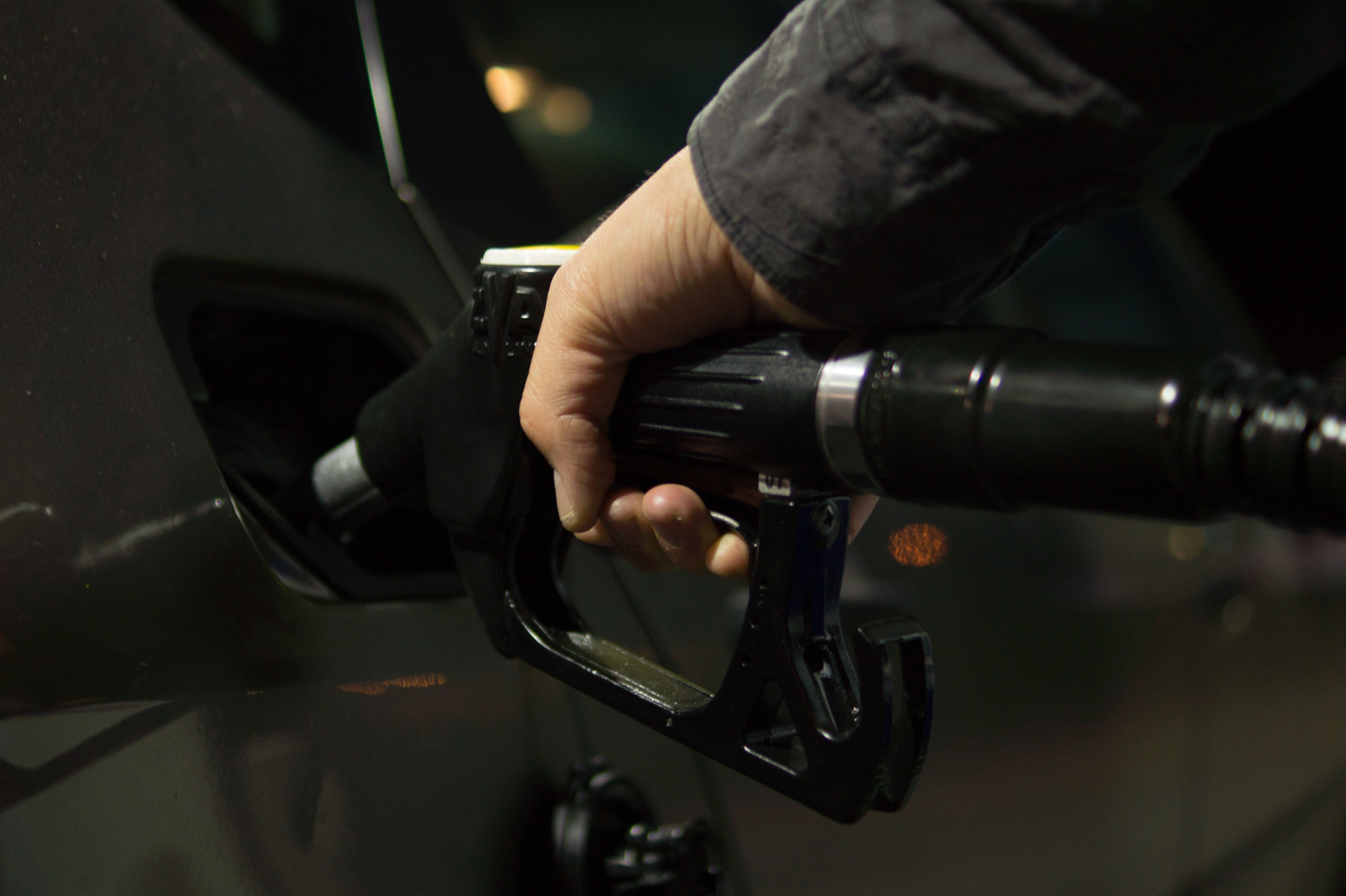 Person Holding Gasoline Nozzle · Free