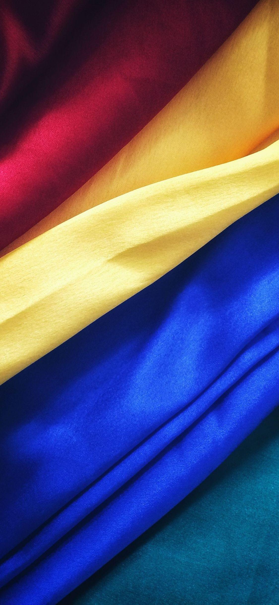 Download 1125x2436 wallpaper fabric, red, yellow and blue