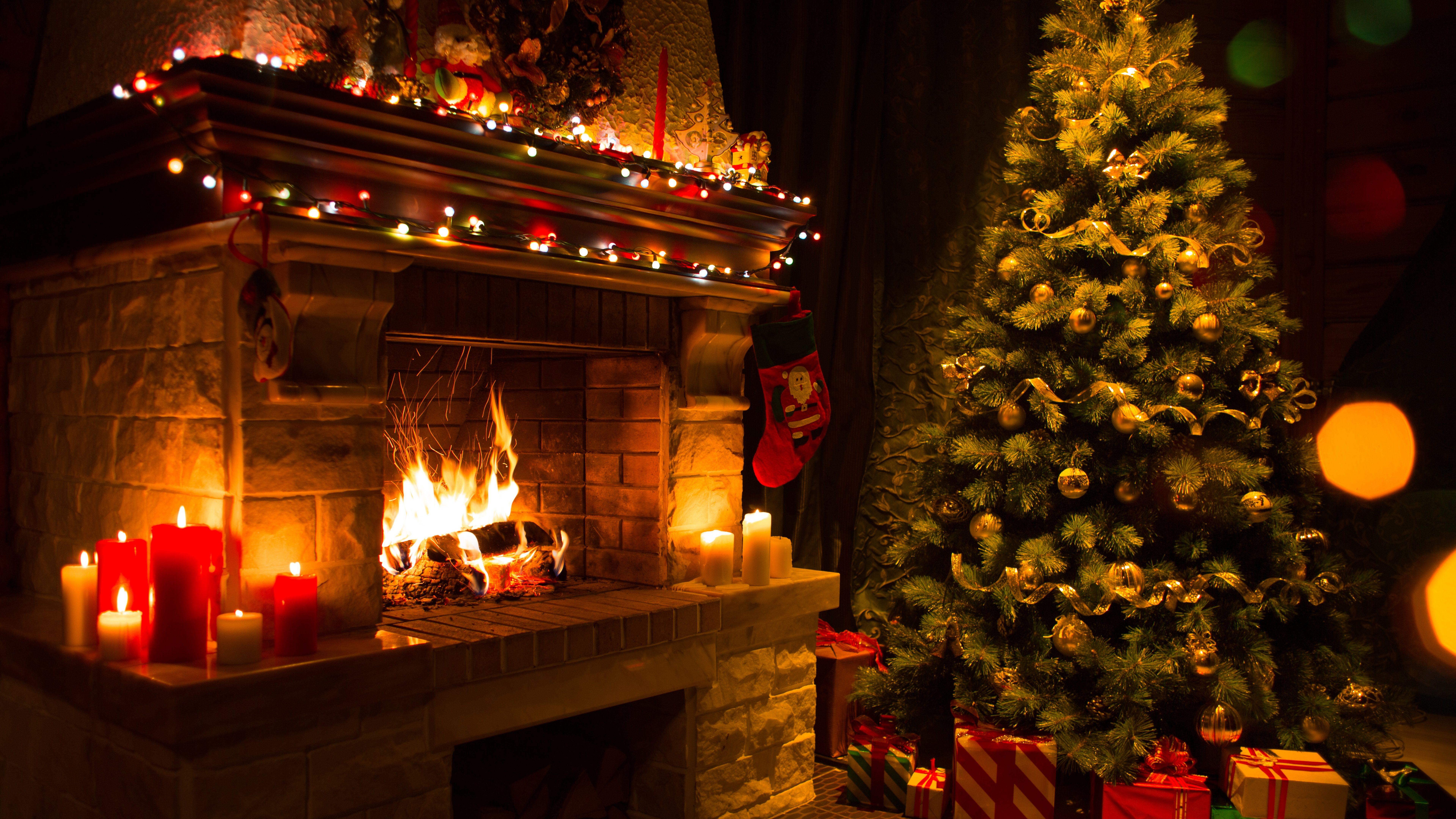 Candle Light In The Fireplace At Christmas 8K UltraHD Wallpaper