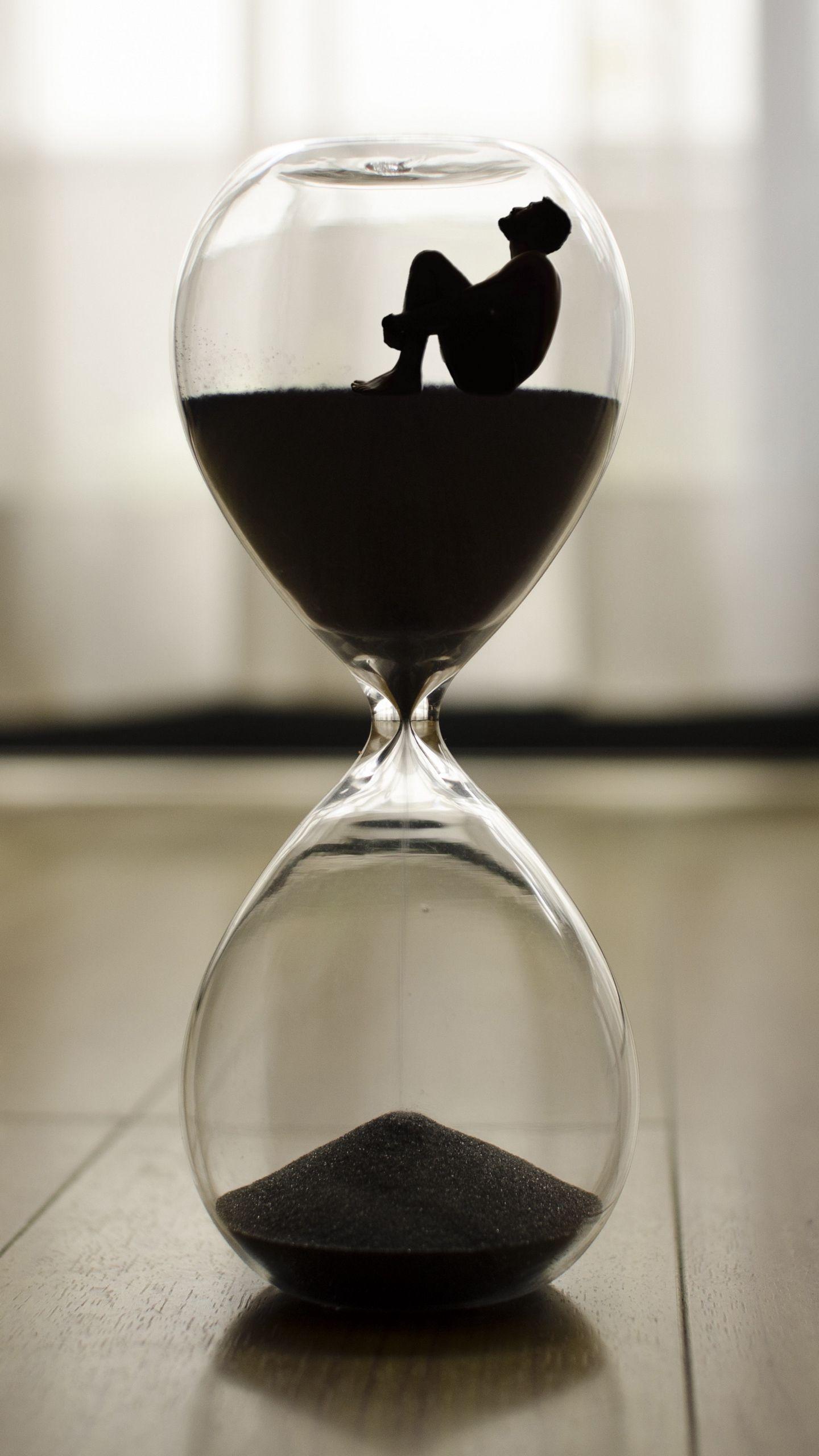 Download wallpaper 1440x2560 hourglass, man, time, loneliness qhd