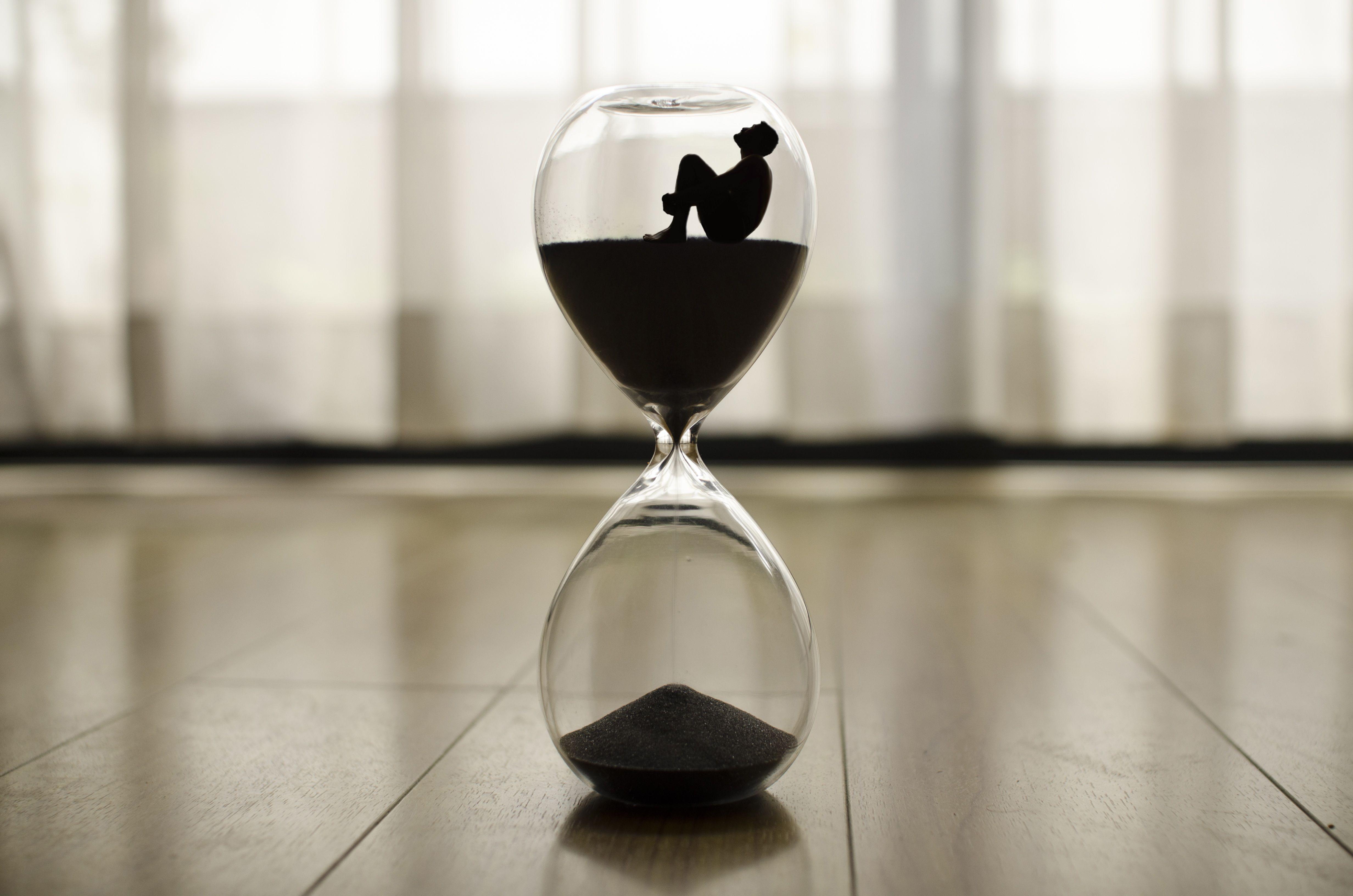 Download wallpaper 4928x3264 hourglass, man, time, loneliness HD