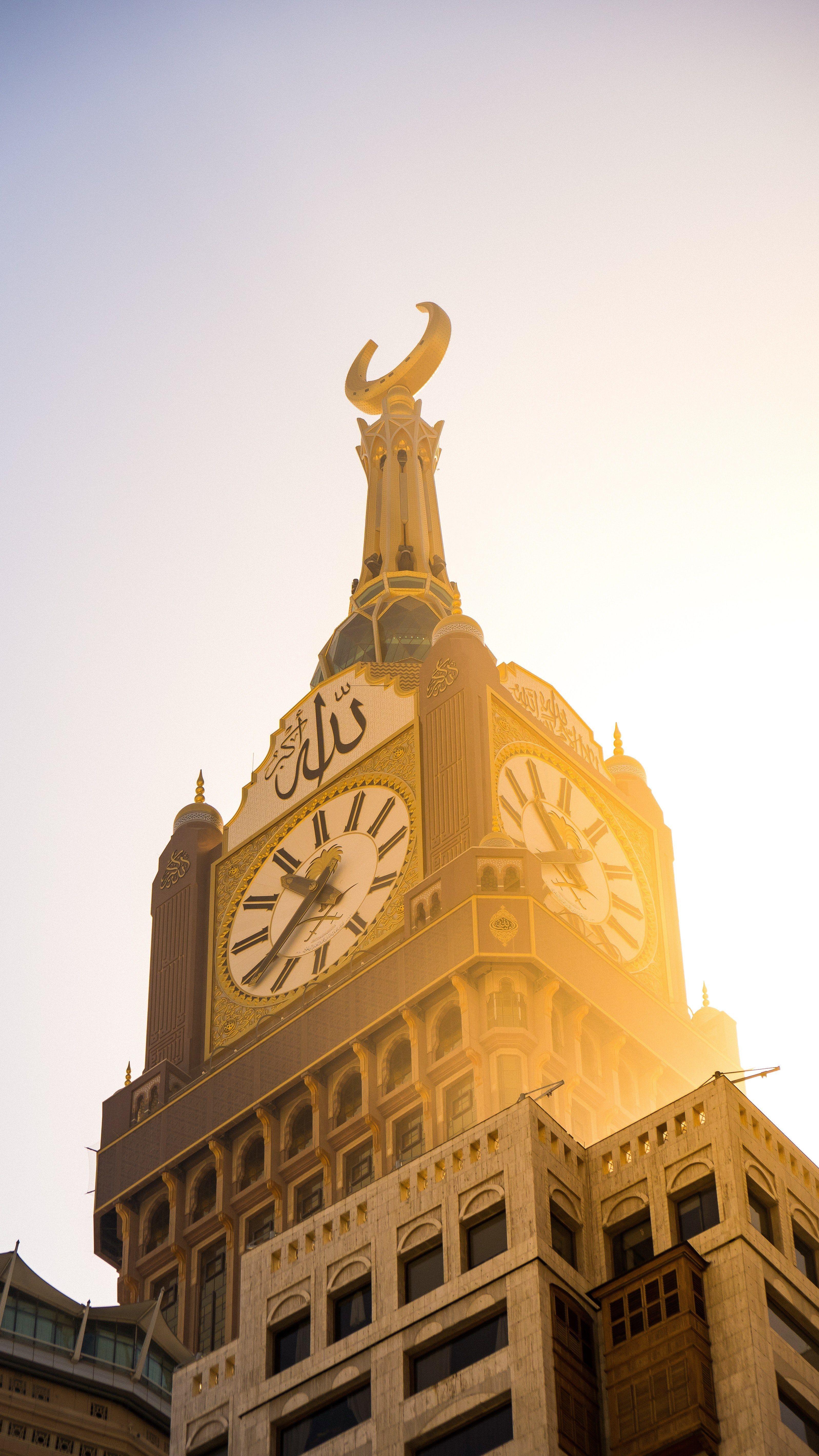 bright royal makkah clock tower wallpaper and background