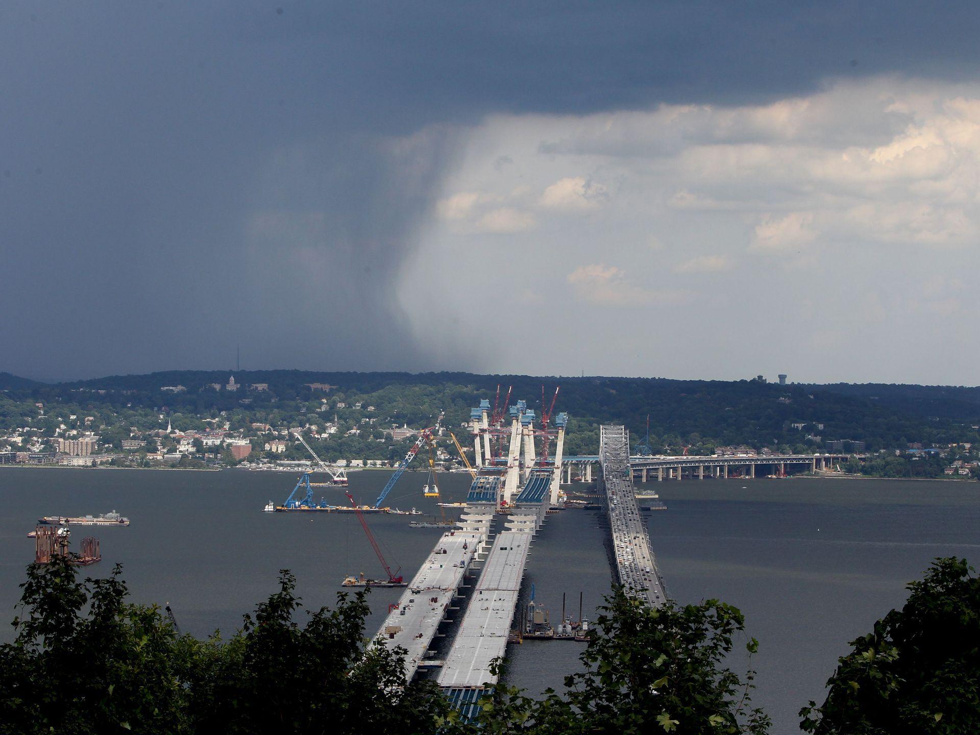 Rain clouds move across the Hudson near the Tappan Zee Bridge