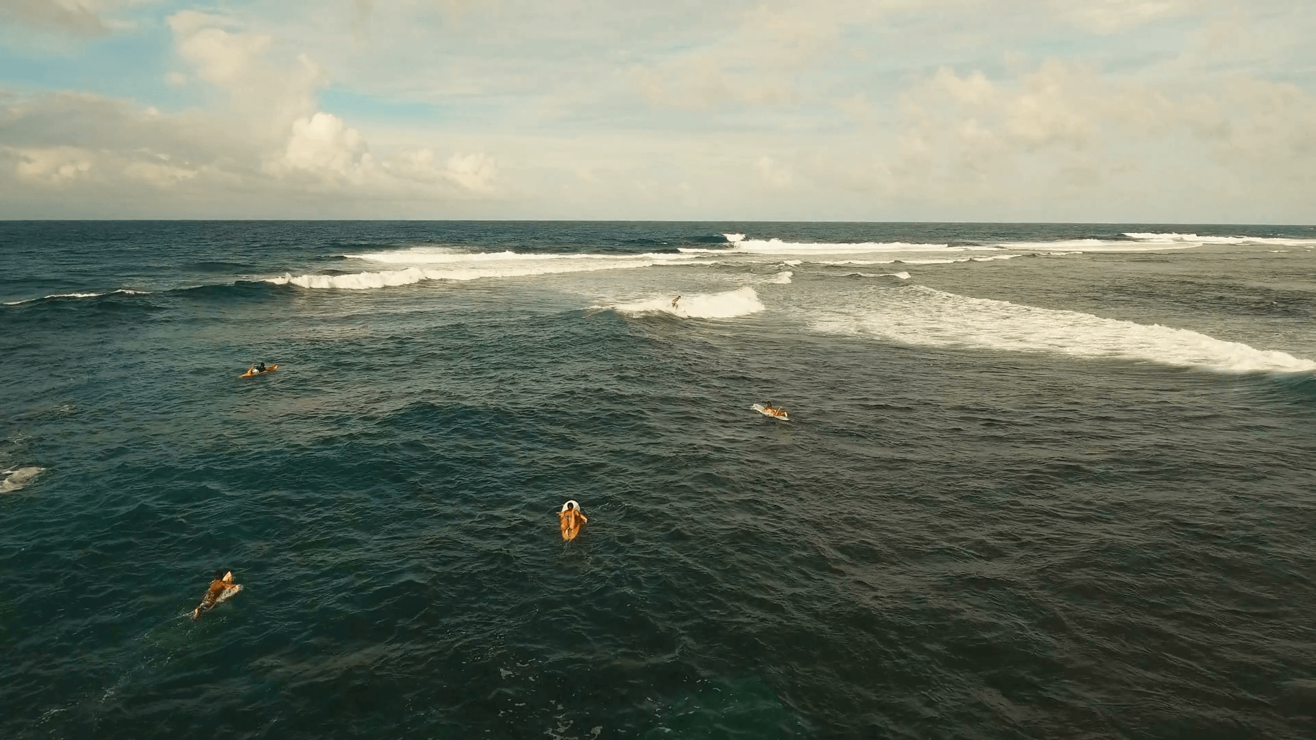 Surfers at siargao islands famous surf break cloud 9 near mindanao