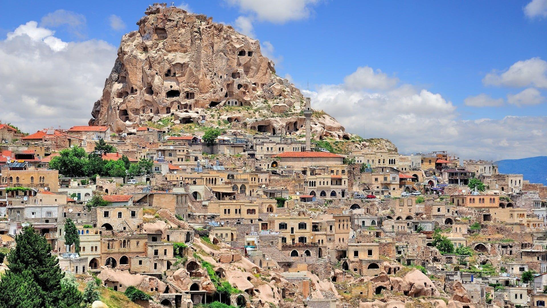 Brown villages near to rock mountain, Turkey, Cappadocia, city