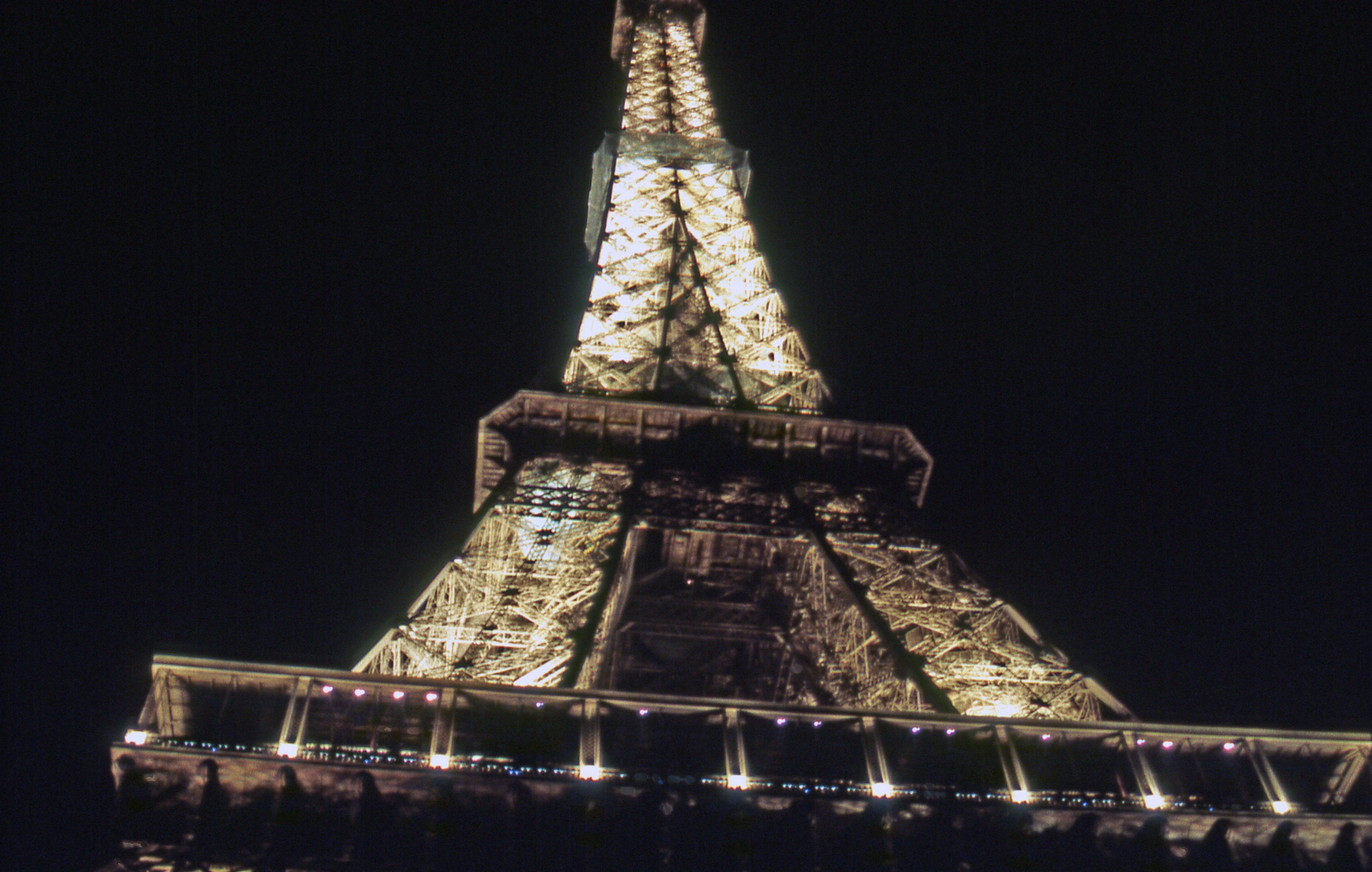eiffel tower by night 4k wallpaper and background