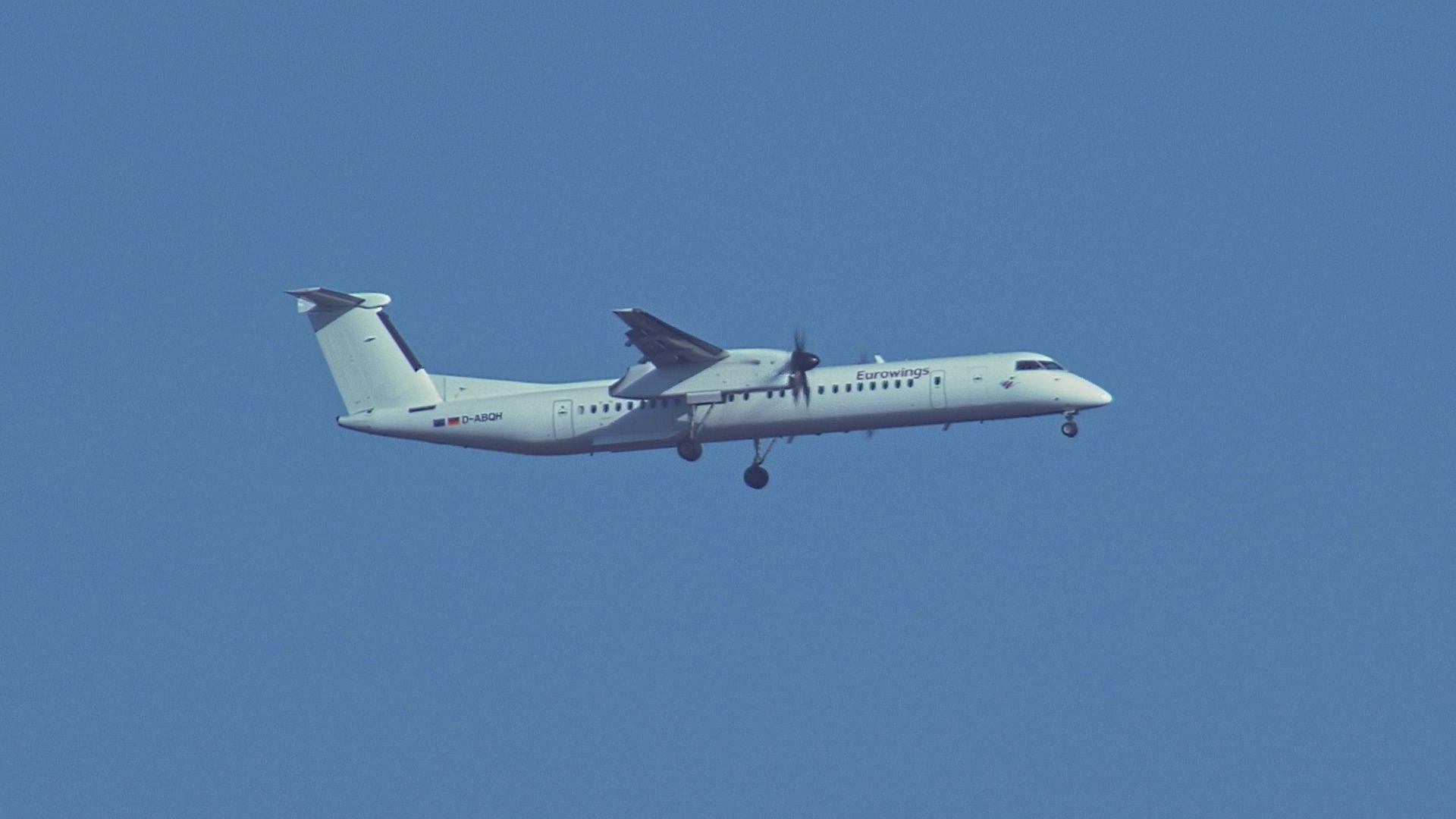 Video: Bombardier Dash 8 Q 400 Airplane Flyby Against A Blue Sky