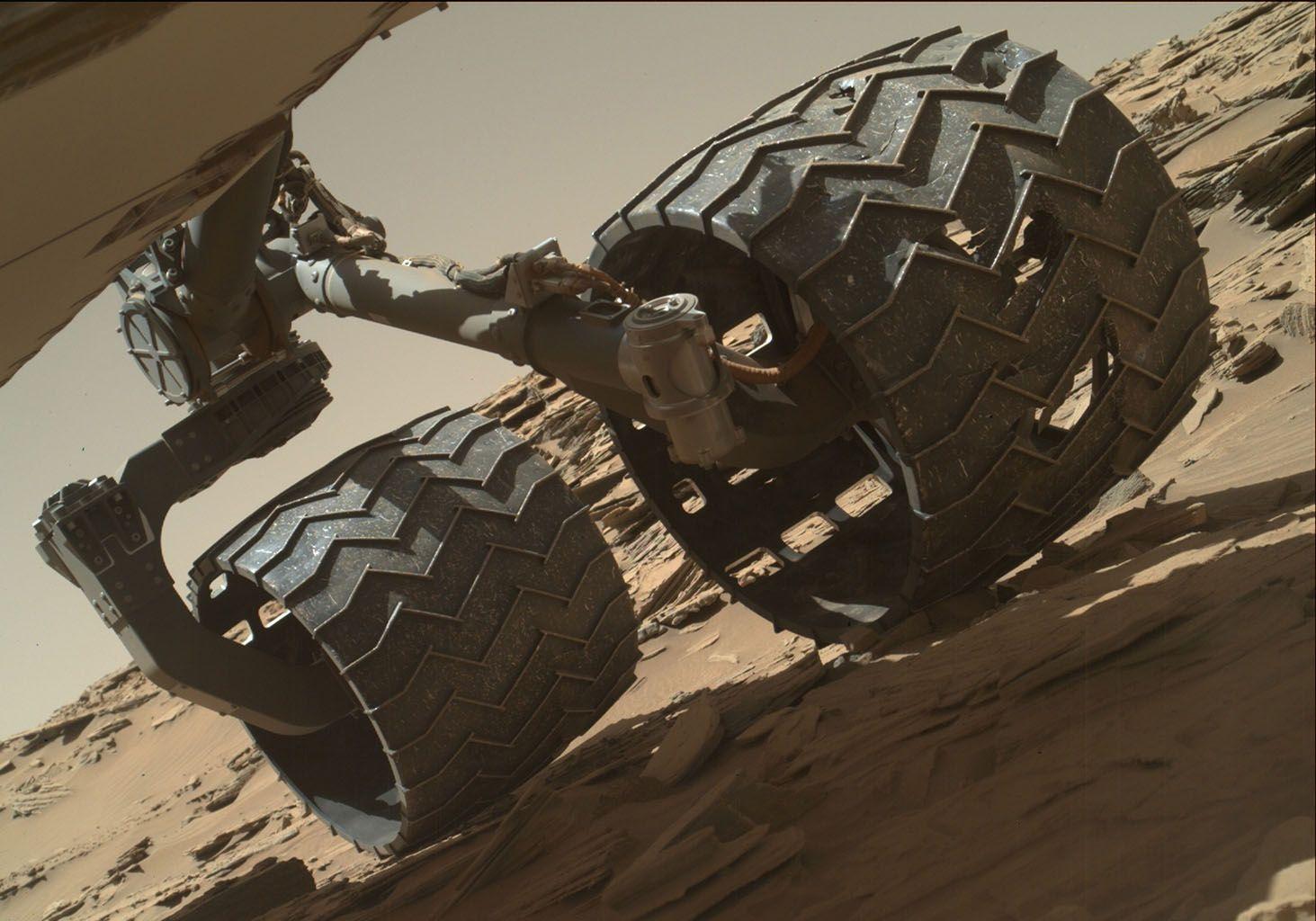Space Image. Routine Inspection of Rover Wheel Wear and Tear