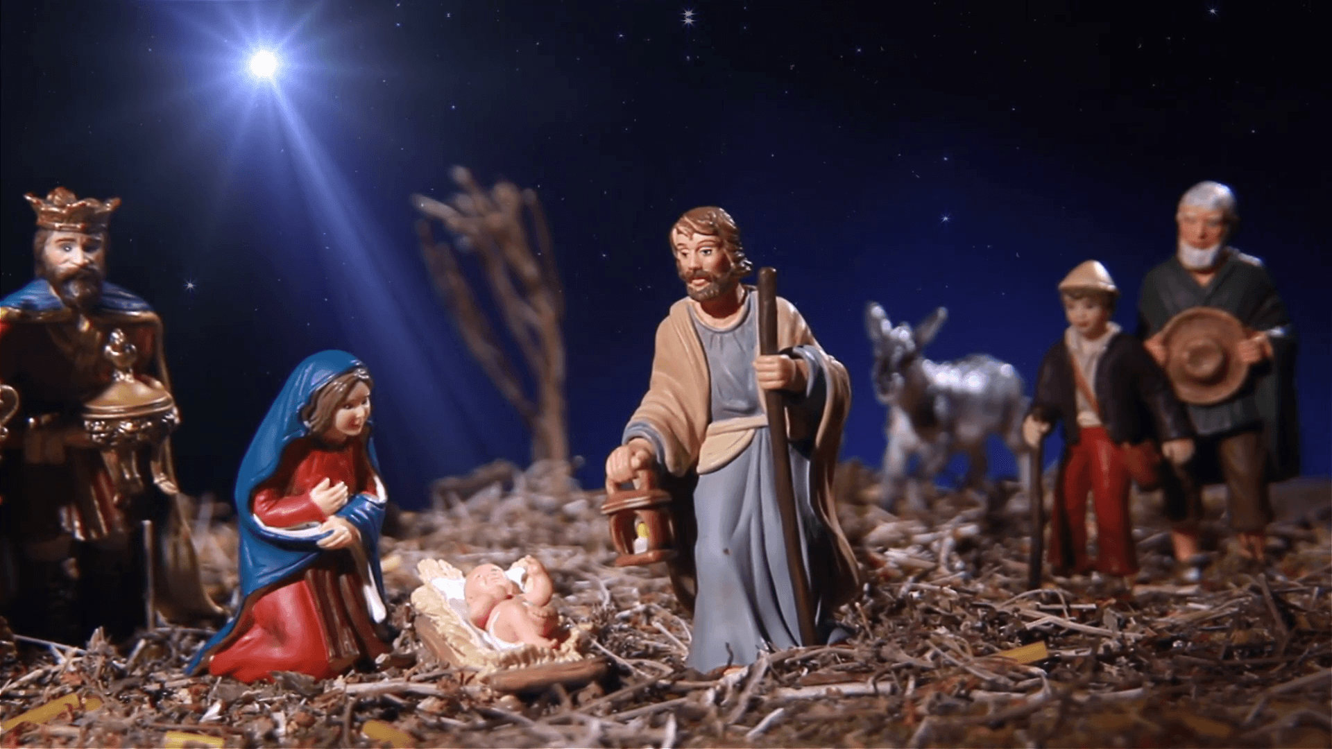 Nativity scene exhibit figures representing the infant Jesus, his
