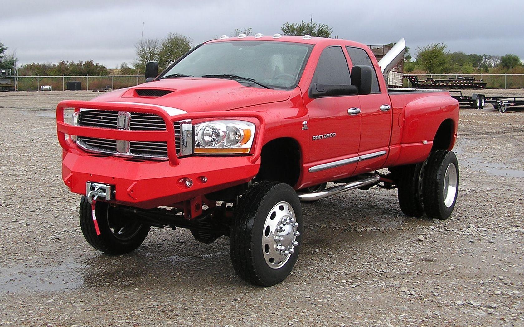 jacked up red chevy trucks
