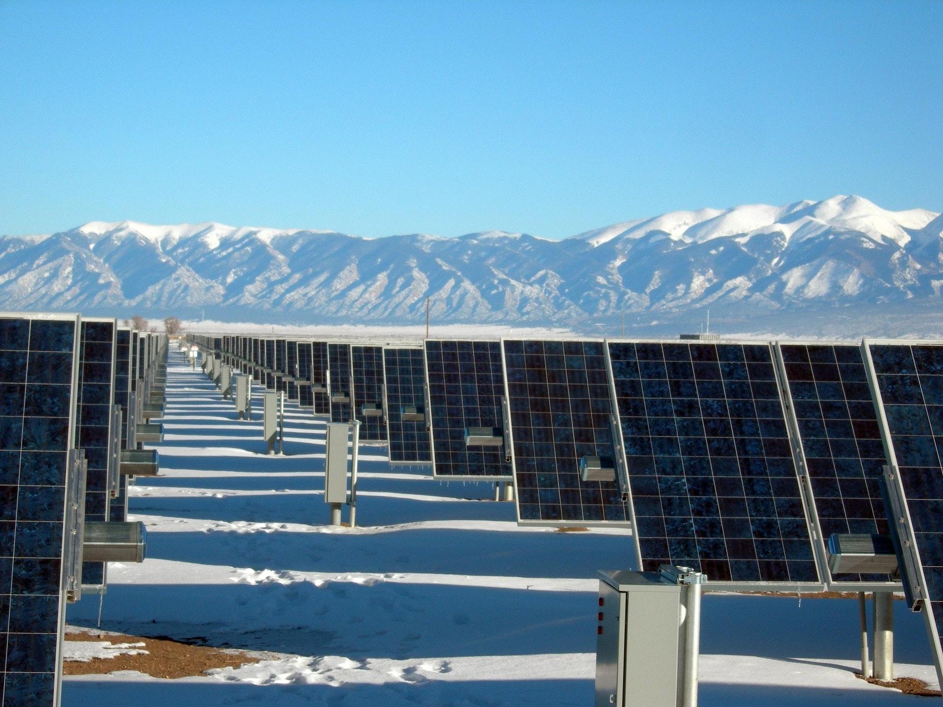 Silver and Black Solar Panels on Snow Covered Ground · Free