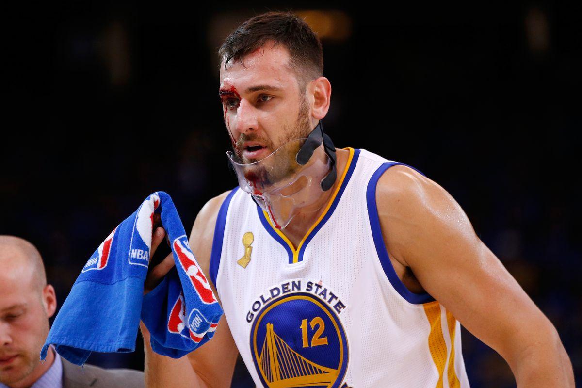 Andrew Bogut forced to leave Warriors opening night win after