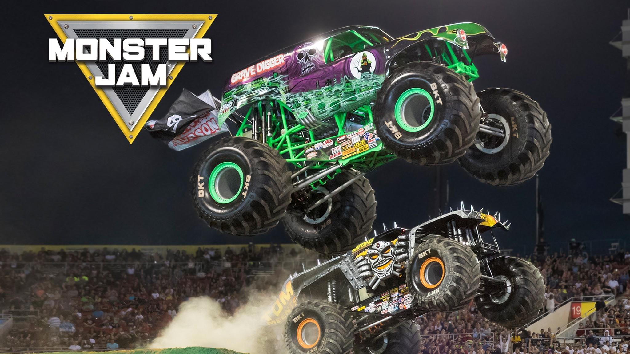 Download Caption Majestic Monster Truck in Action Wallpaper  Wallpapers com