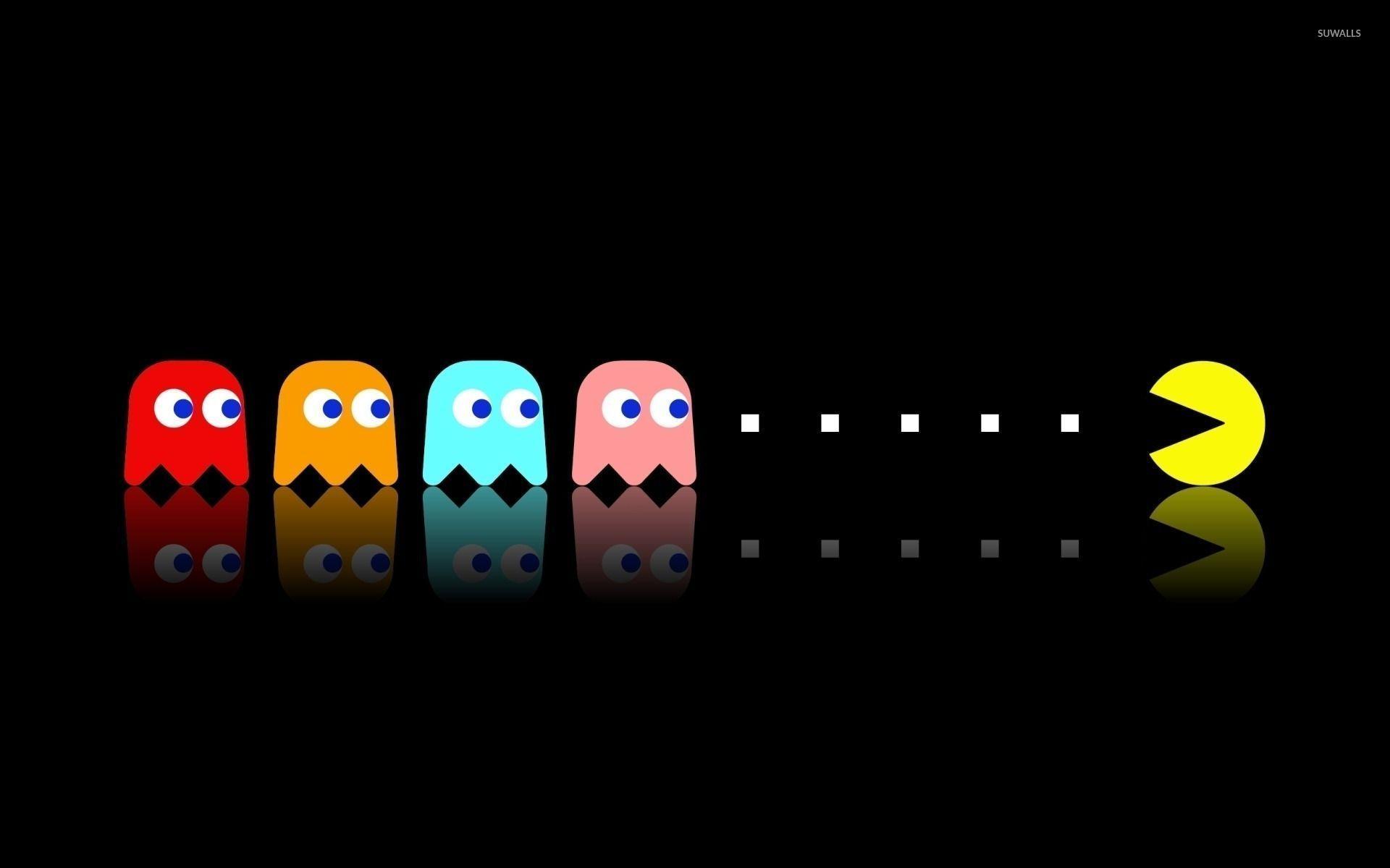 Pac Man Chasing The Ghosts Wallpaper Wallpaper
