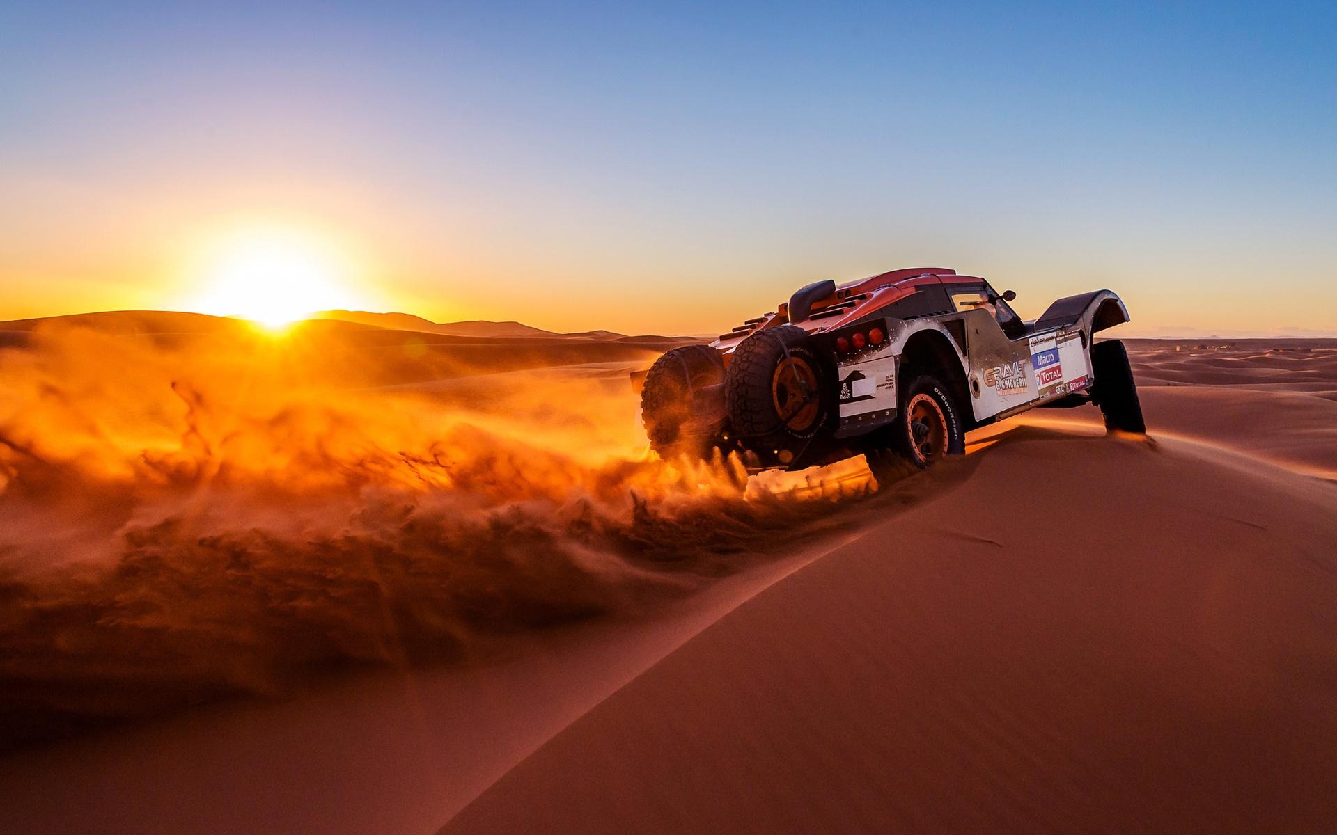Sunset Over Buggy In Dakar Rally Wallpaper