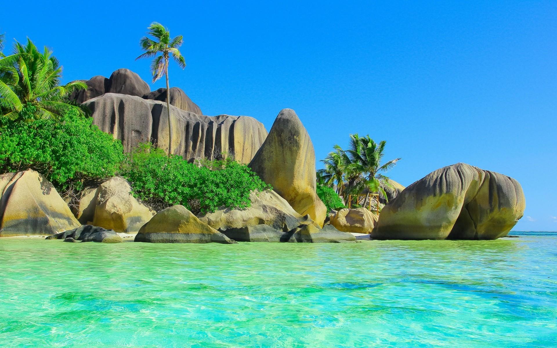Huge smooth stones on a tropical island wallpaper and image