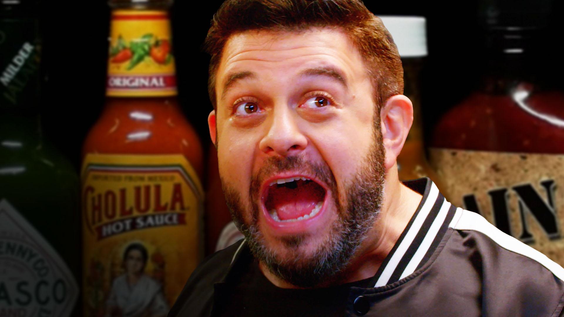 Watch Adam Richman Take on the Hot Ones Challenge. First We Feast