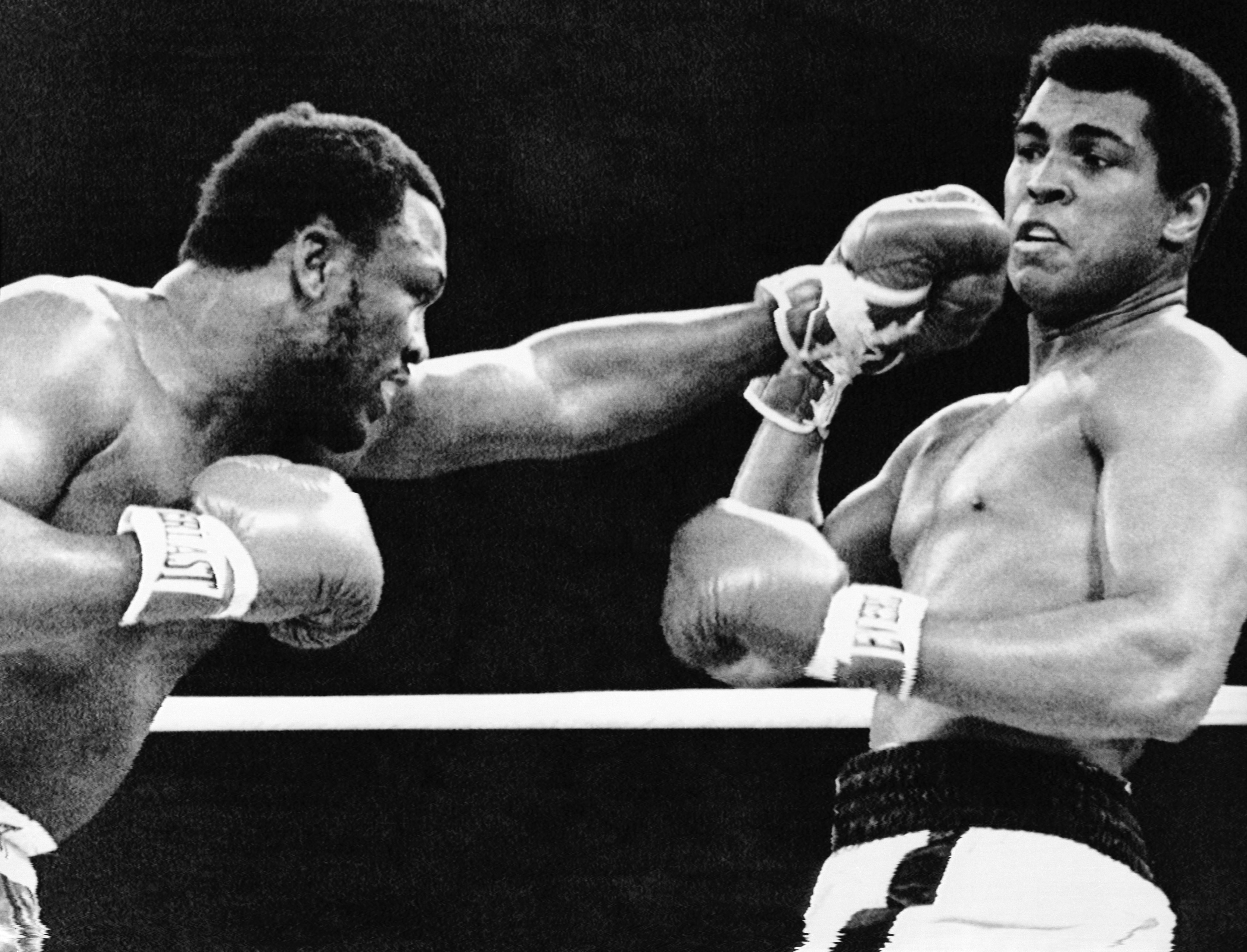 Joe Frazier Throwing Punch at Muhammad Ali. A Long And Perilous Voyage