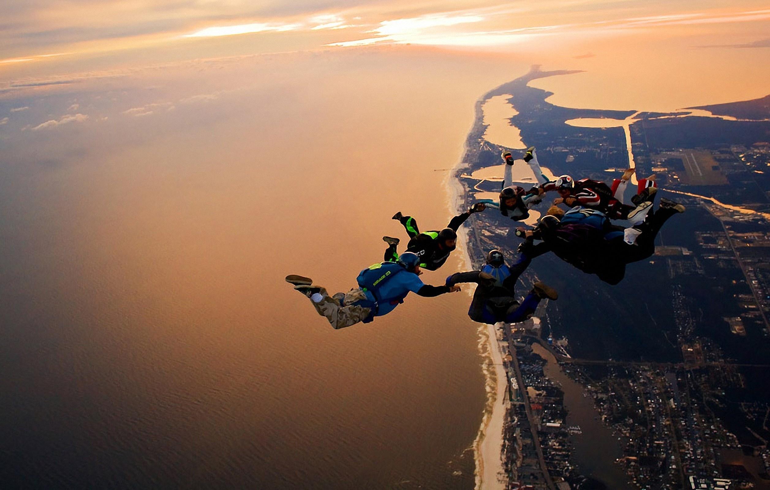 Jumpers jump fly sky sea land view cool parachute skydiving