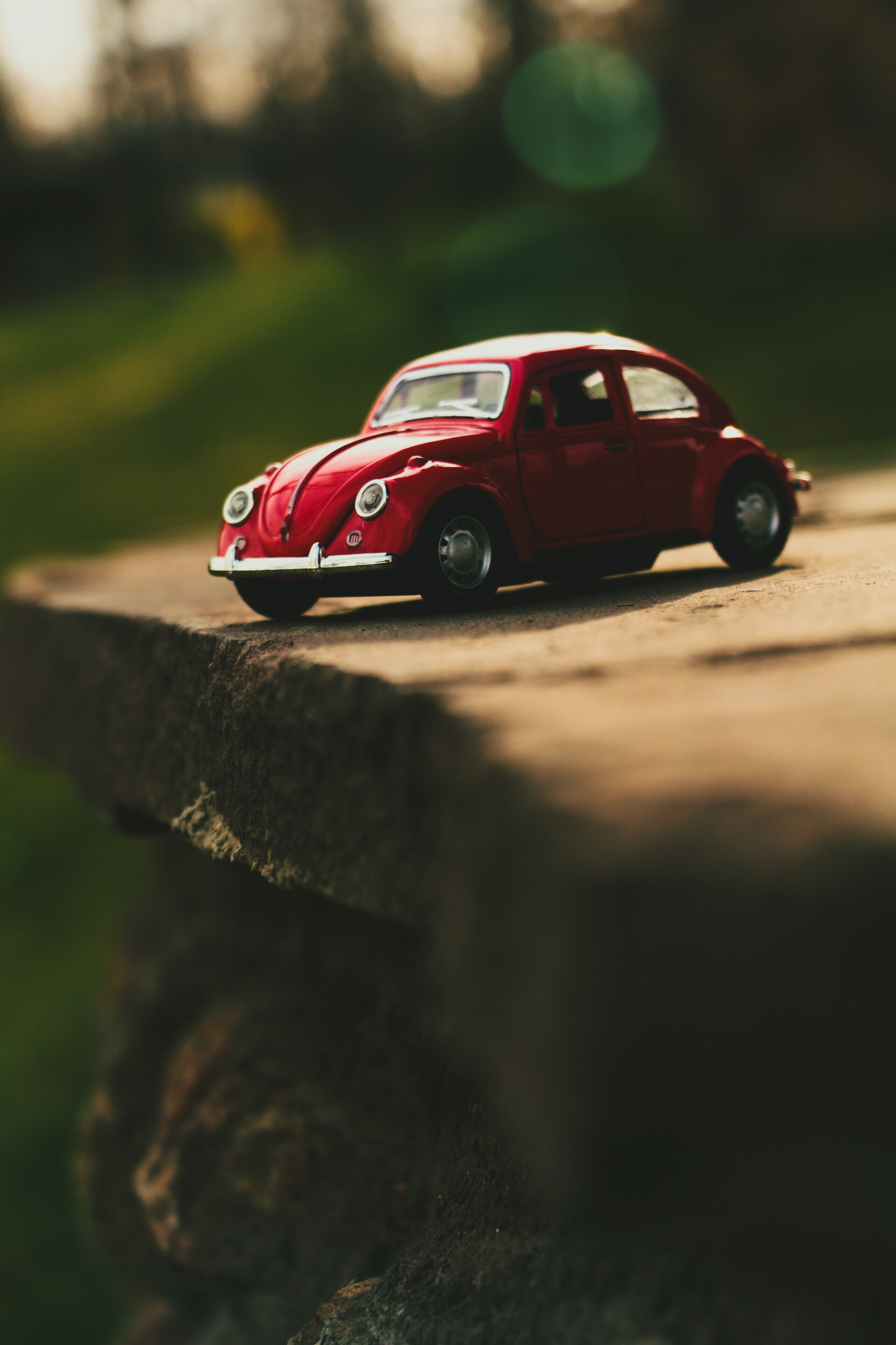 close up photo of red volkswagen beetle scale model free image