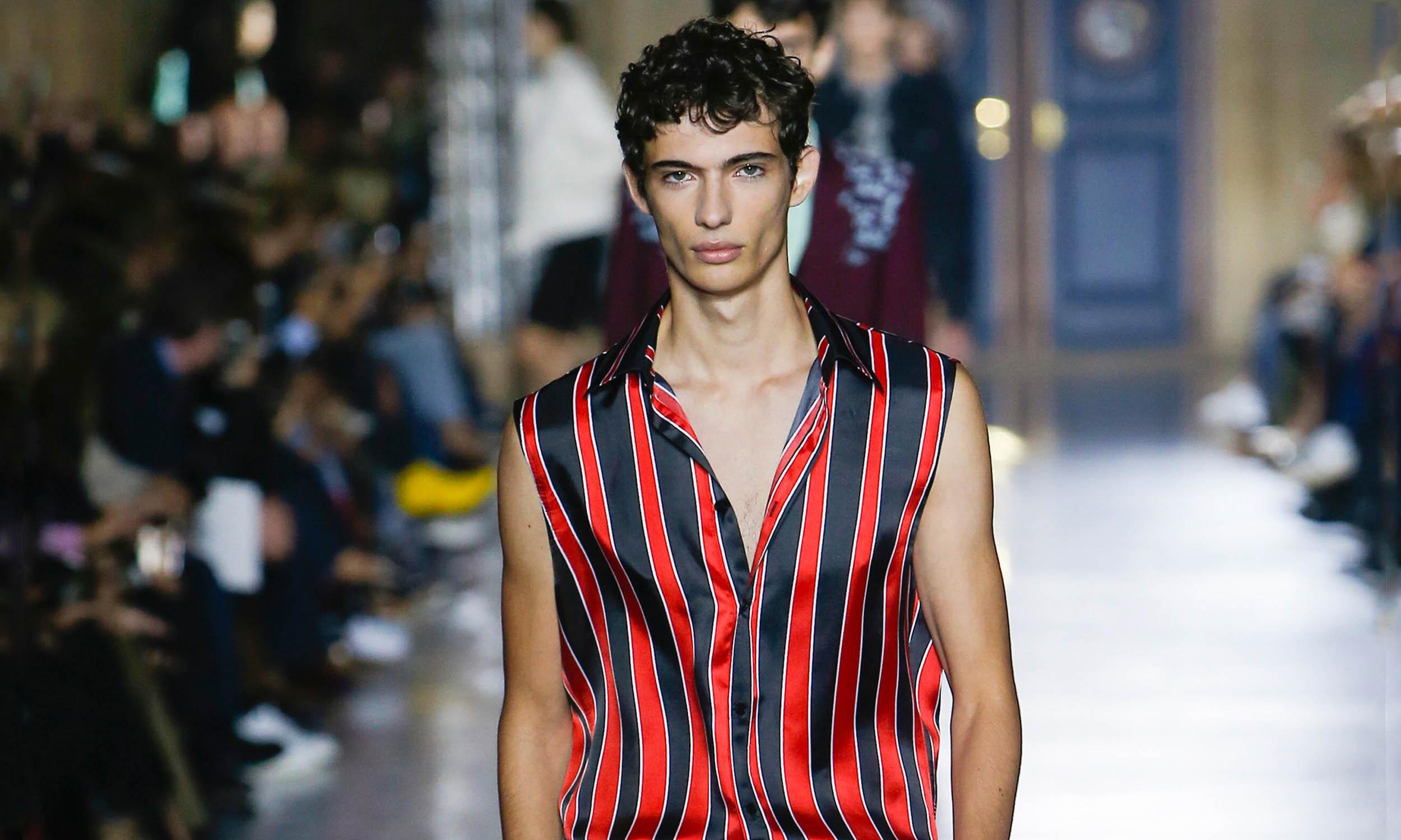 Male model, Piero Mendez, walking the catwalk at Givenchy SS18 m