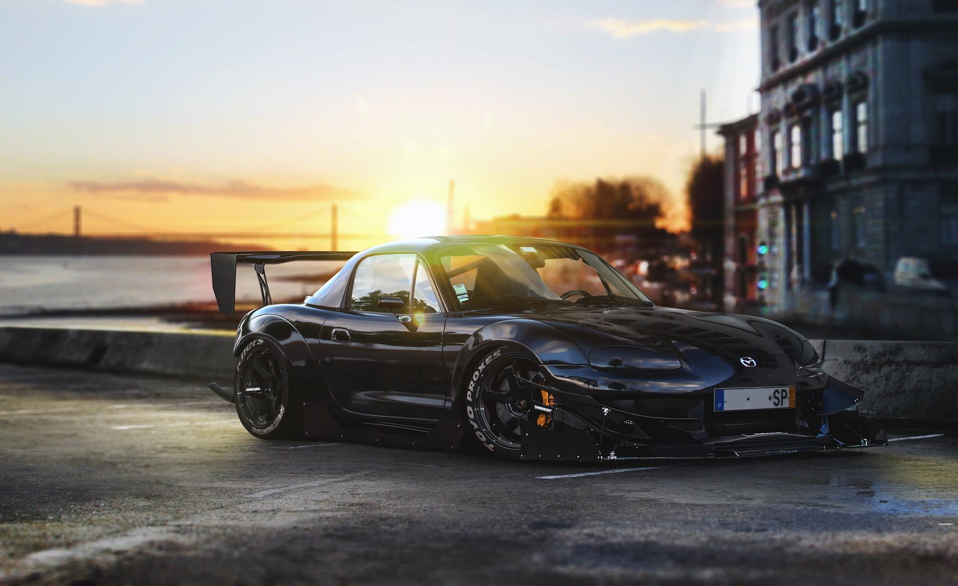 Sleek Black Mazda MX 5 HD Wallpaper At Sunset By The Waterfront