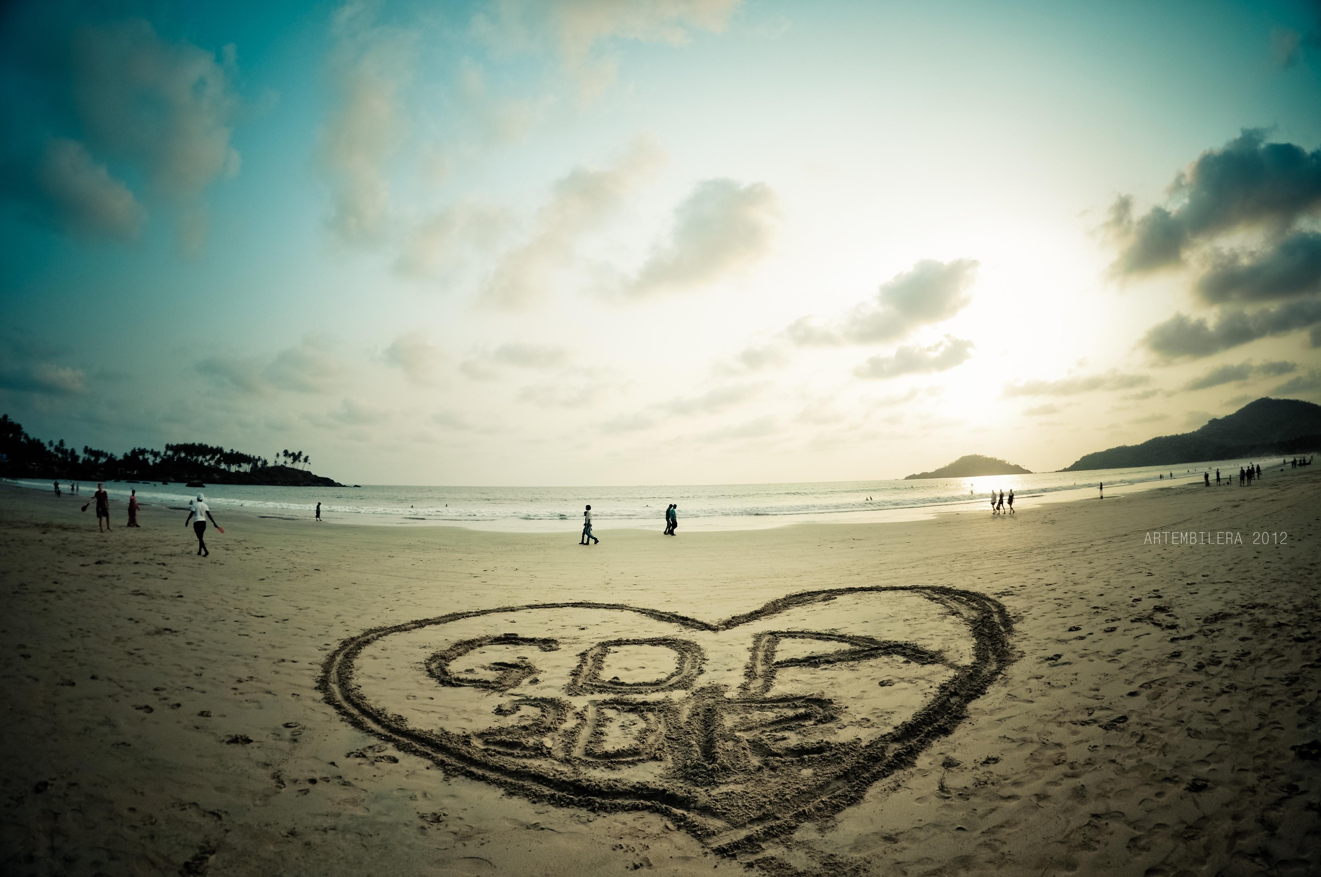 Drawing on the sand in Goa wallpaper and image