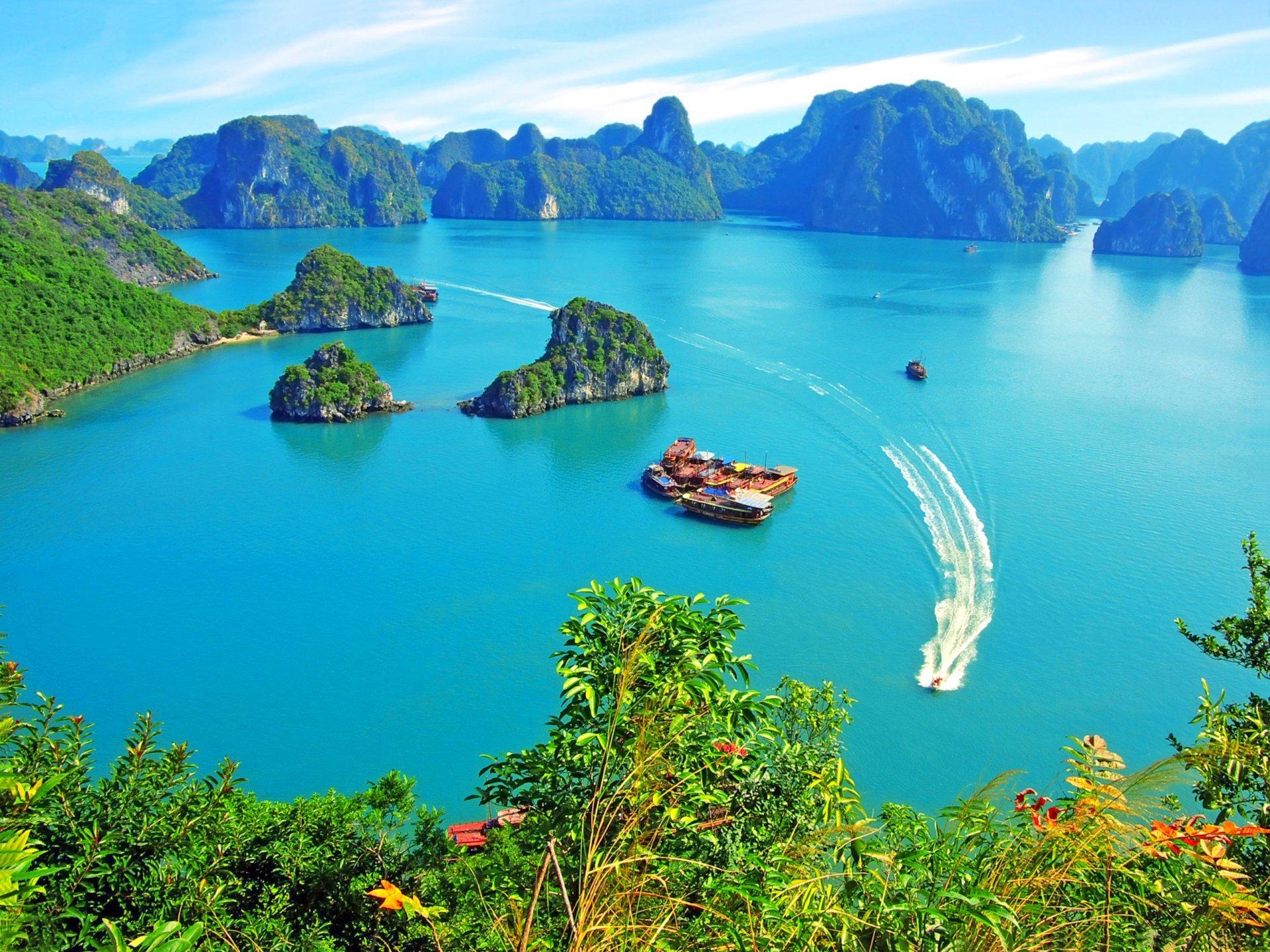 vietnam halong bay rock islands vegetation pleasure boats yacht