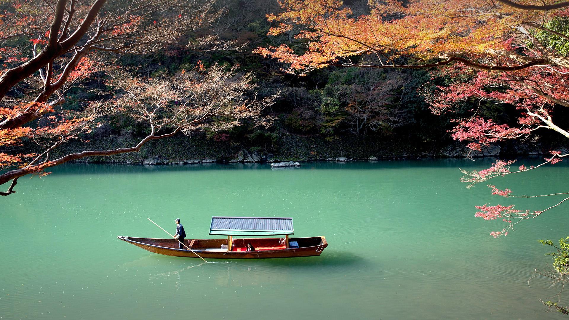 Rowing boat on Katsura river, Arashiyama, Japan. Windows 10