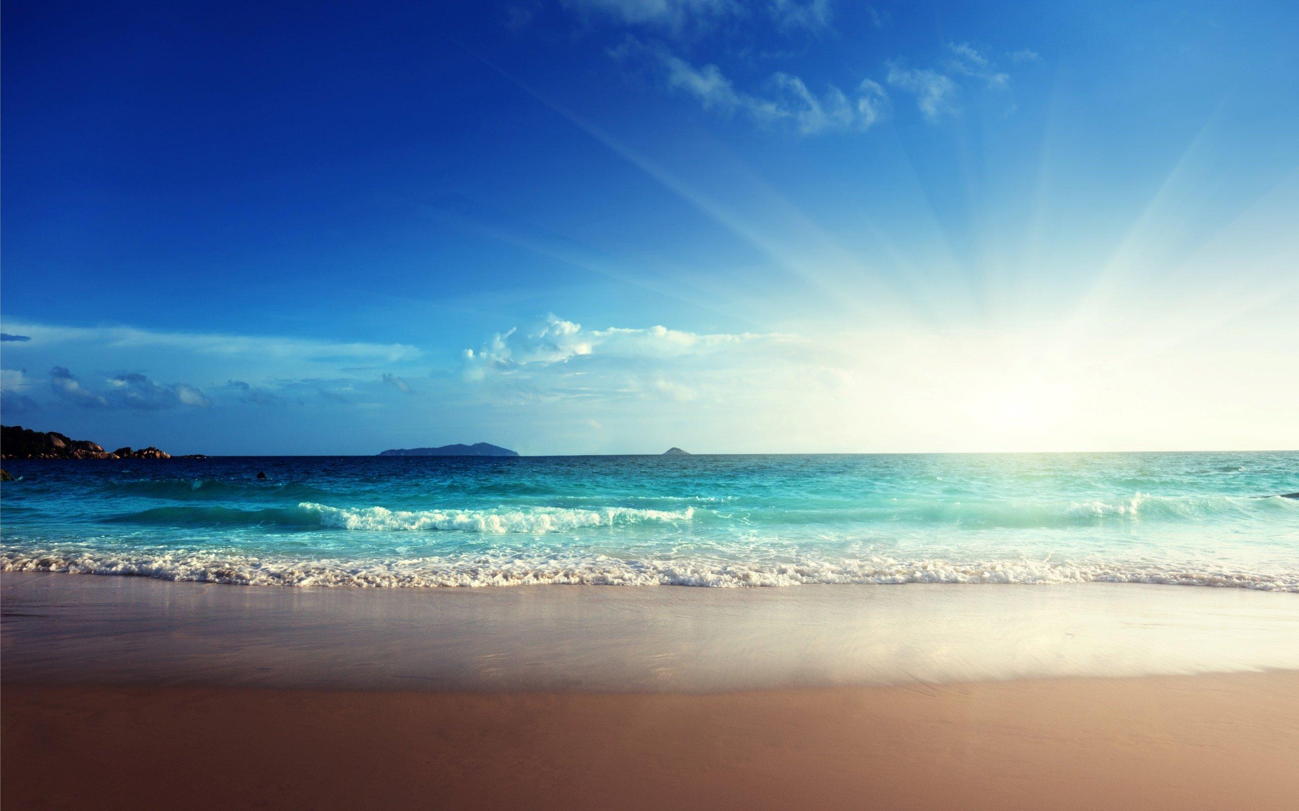 Sunshine emerald beach sand blue sea wallpaperx1600