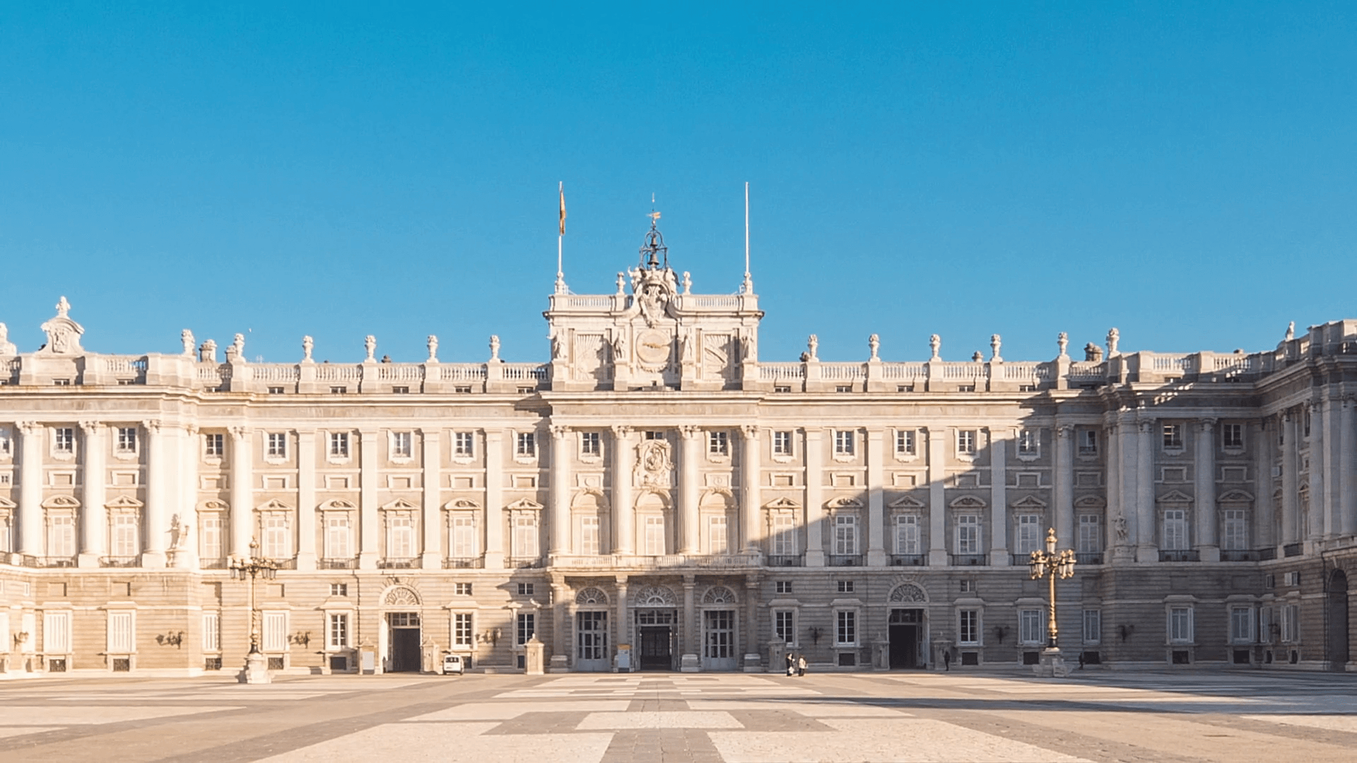 royal palace of madrid timelapse zoom out blue sky sun lighting