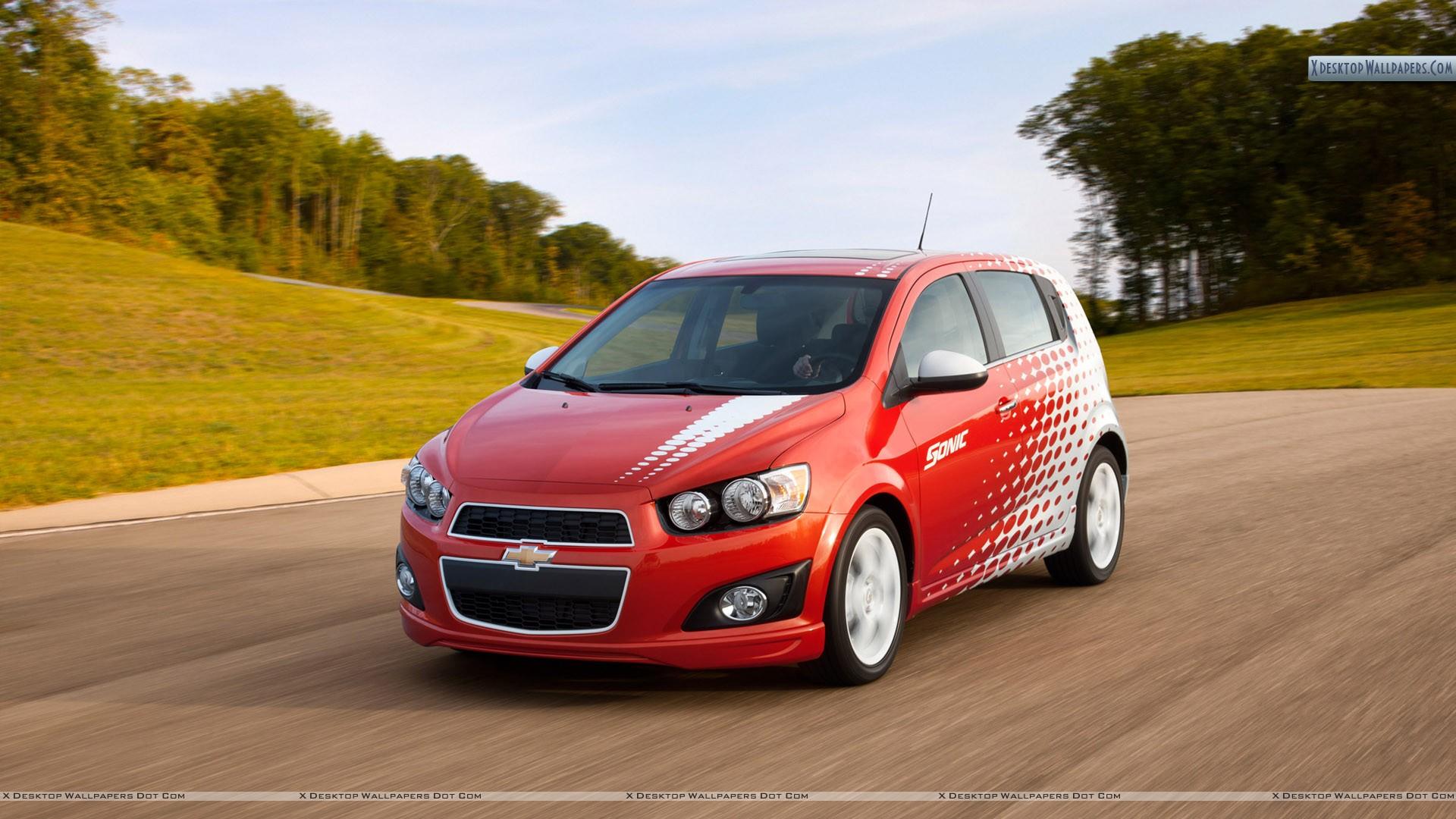Chevrolet Sonic Z Spec Running On Highway Wallpaper