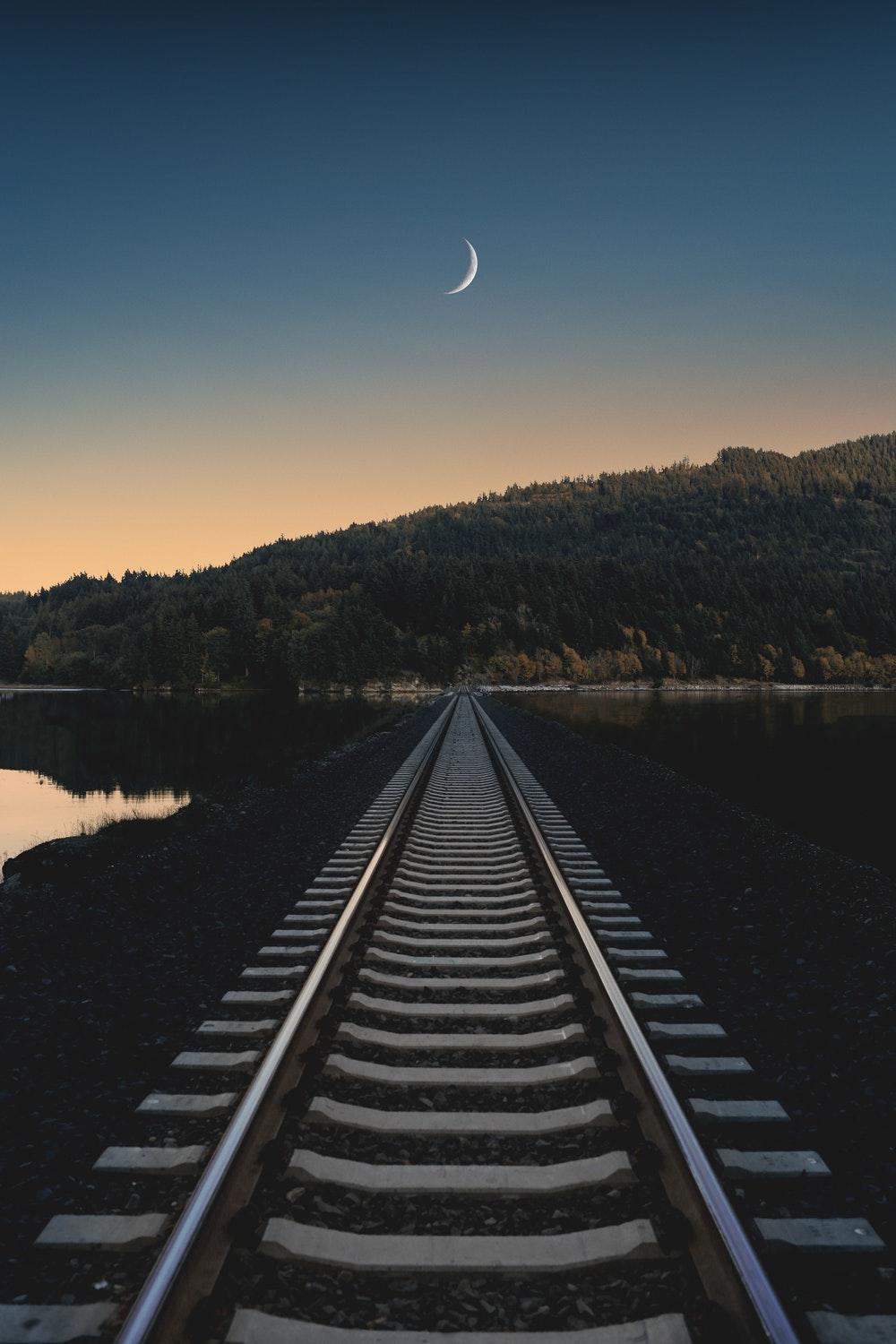 Train track, track, moon and sunset