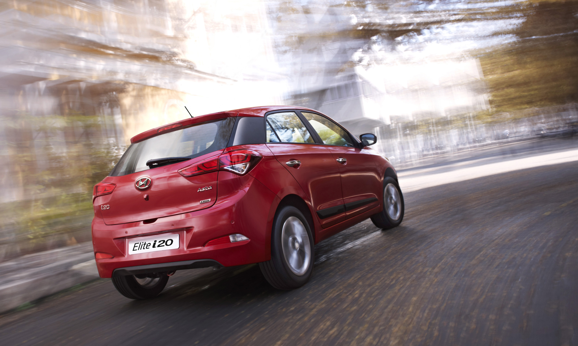 Hyundai i20 red color rear side view bulr city background HD