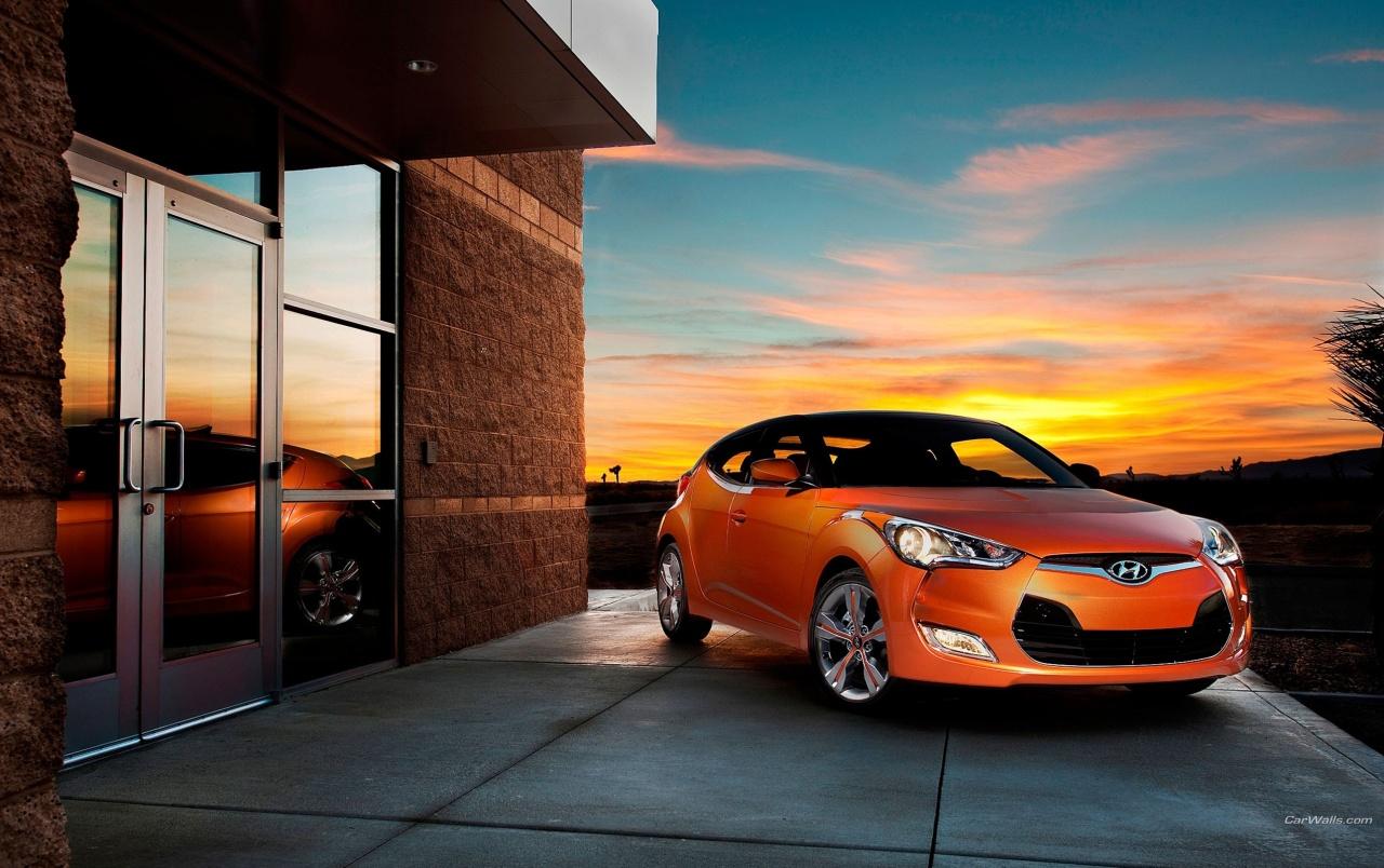 Orange Hyundai Veloster at Sunset wallpaper. Orange Hyundai