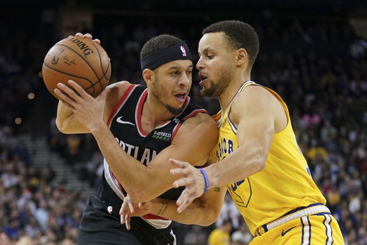 Warriors Steph Curry and Blazers Seth Curry swap jerseys