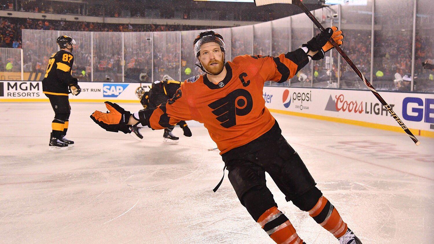 Claude Giroux celebrates after winning the Stadium Series game