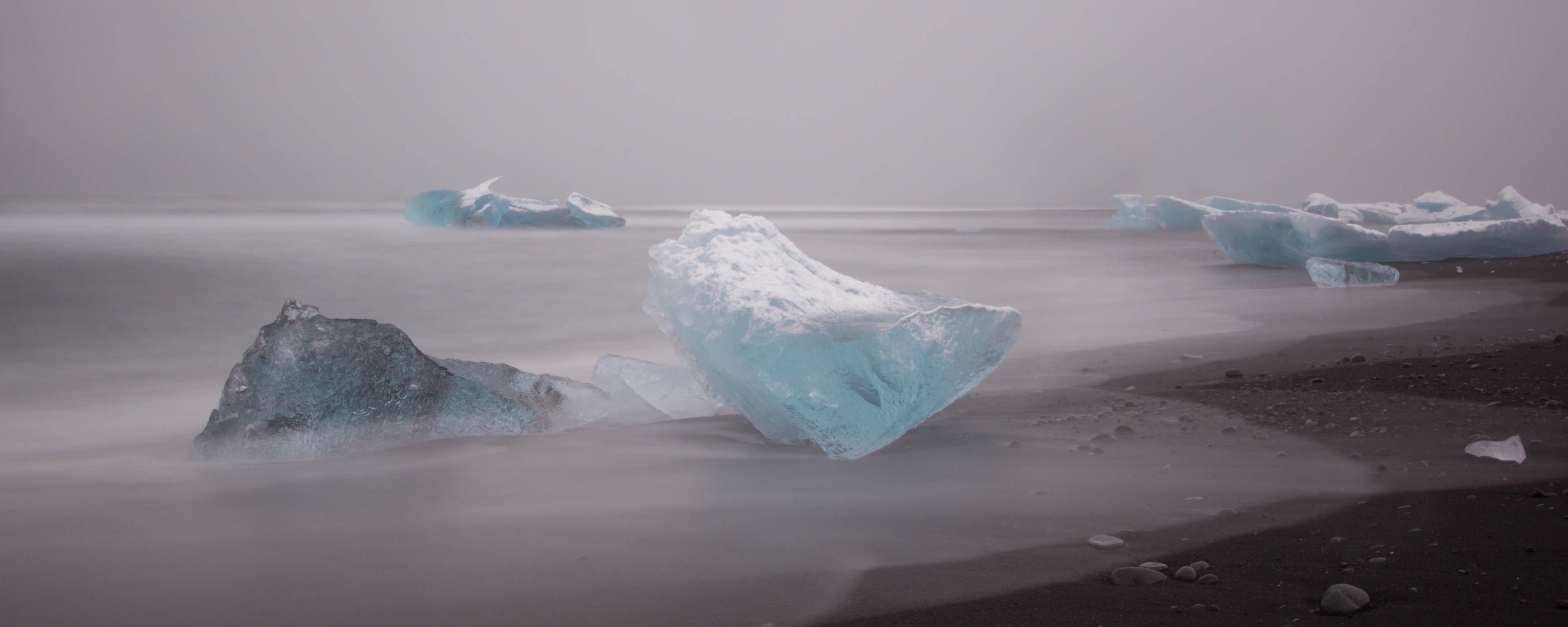 Iceland Icebergs on a Black Volcanic Sand Beach and a