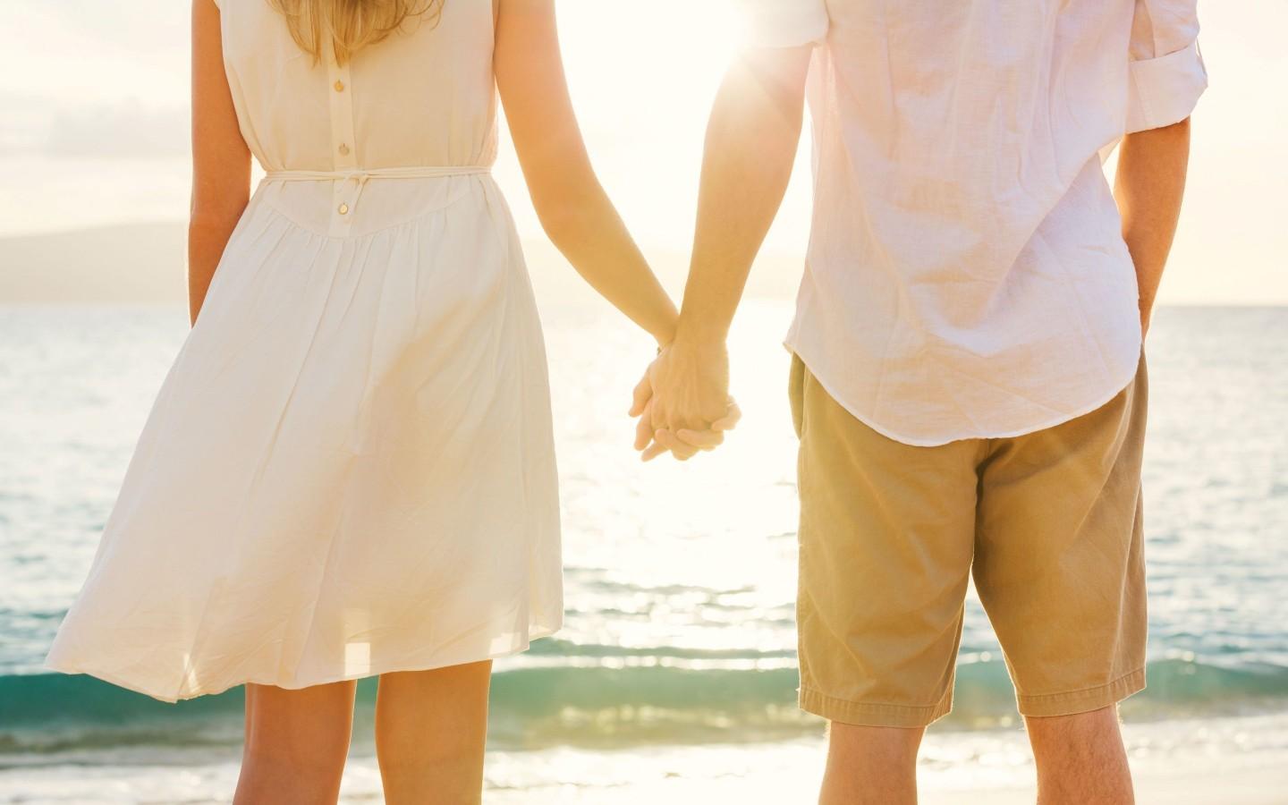 Boy and Girl Holding Hands on the Beach widescreen wallpaper. Wide