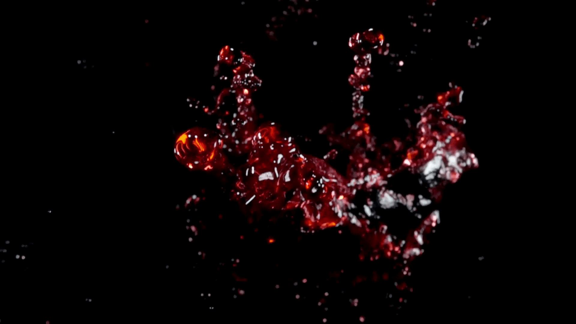 Grape juice, red wine flies to the camera on a black background