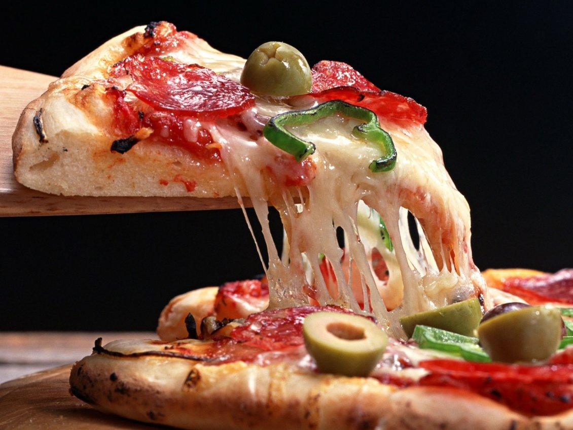 Hot cheese stretches slice of pizza