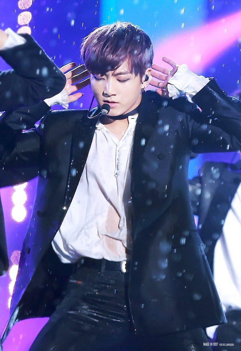 amazing photo of BTS's Jungkook dancing in the rain that will
