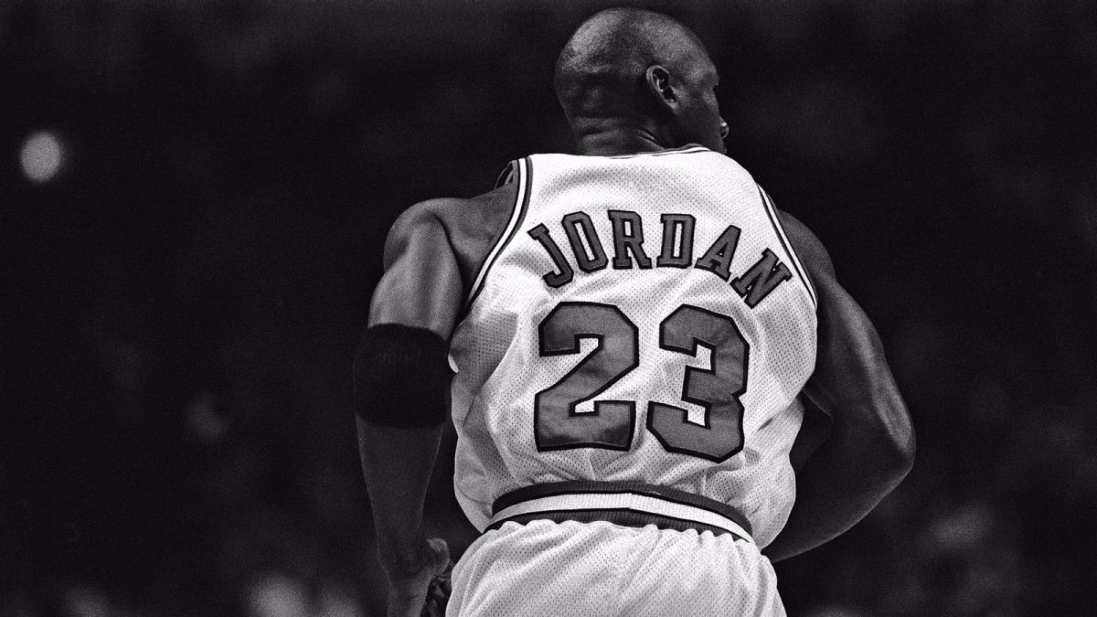 Download Michael Jordan in His Iconic Jersey Wallpaper  Wallpaperscom
