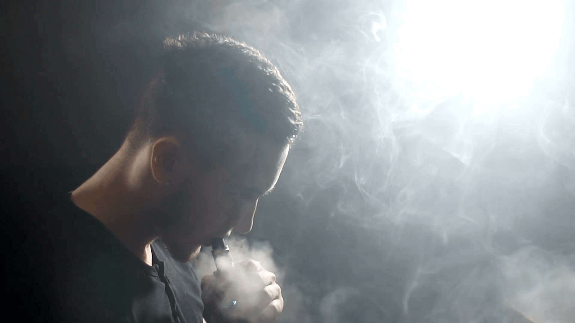 Young Vaper Man Exhaling Big Clouds Of Smoke With E Cigarette Vape