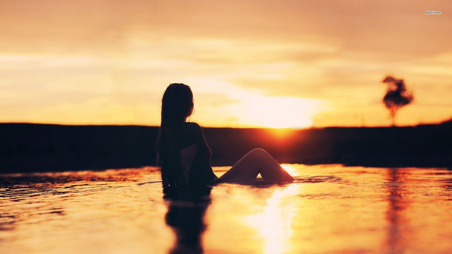Girl in the lake at sunset wallpaper wallpaper