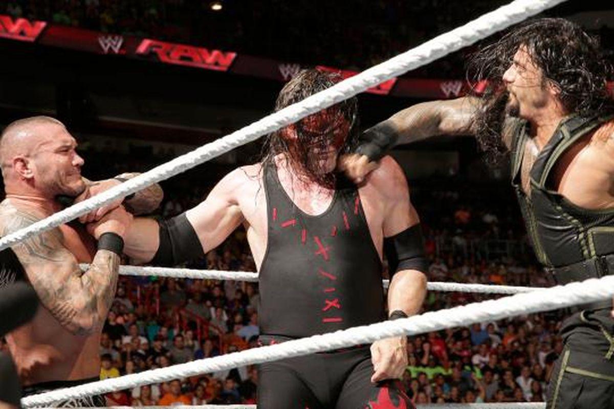 GIF: Roman Reigns superman punch hits Kane so hard Randy Orton feels