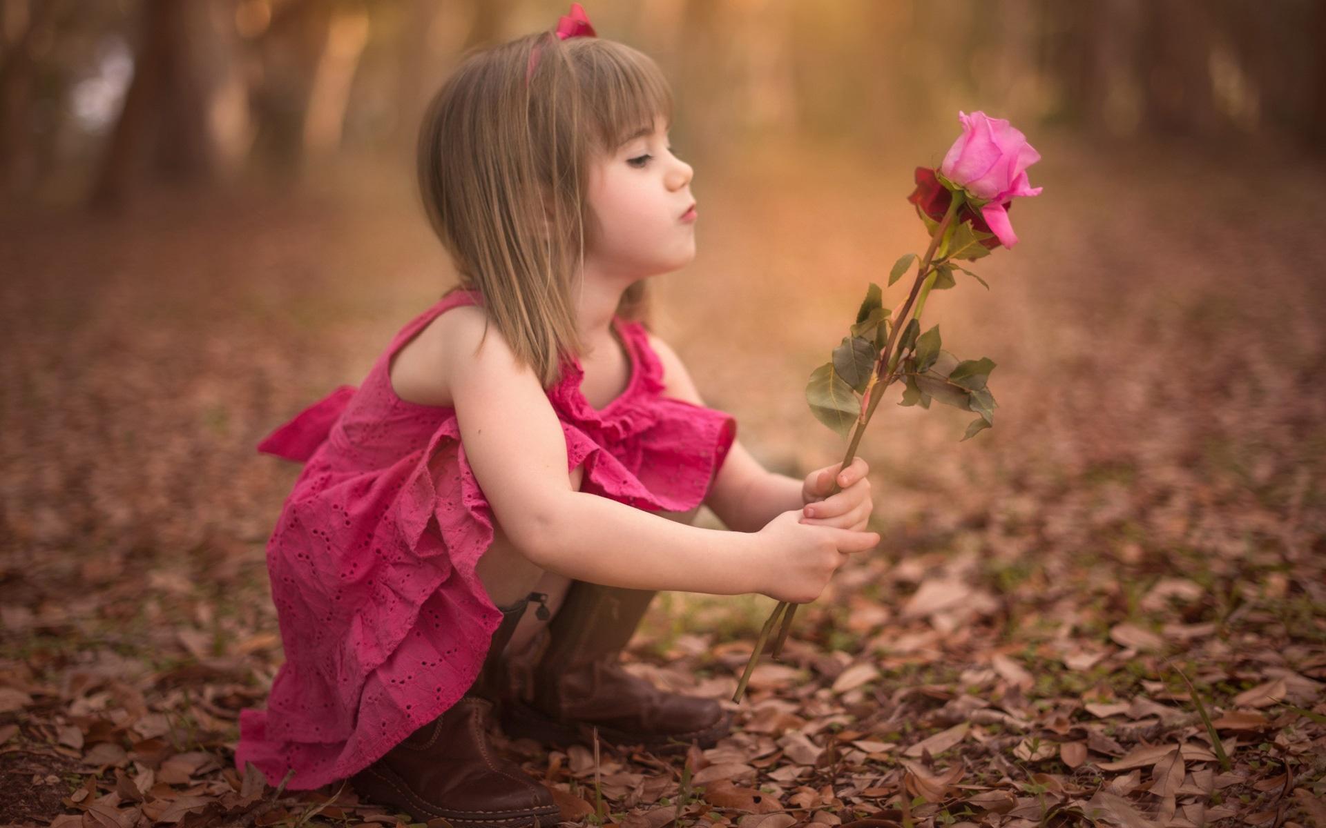 Wallpaper Cute little girl holding rose flower 1920x1200 HD Picture
